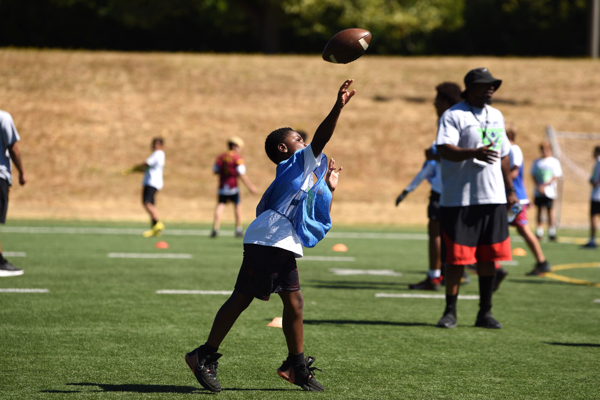 Jones hosted the camp and provided autographed photographs for more than 100 JBLM children from the ages of 6-14. (U.S. Air Force by Airman 1st Class Kylee Tyus)