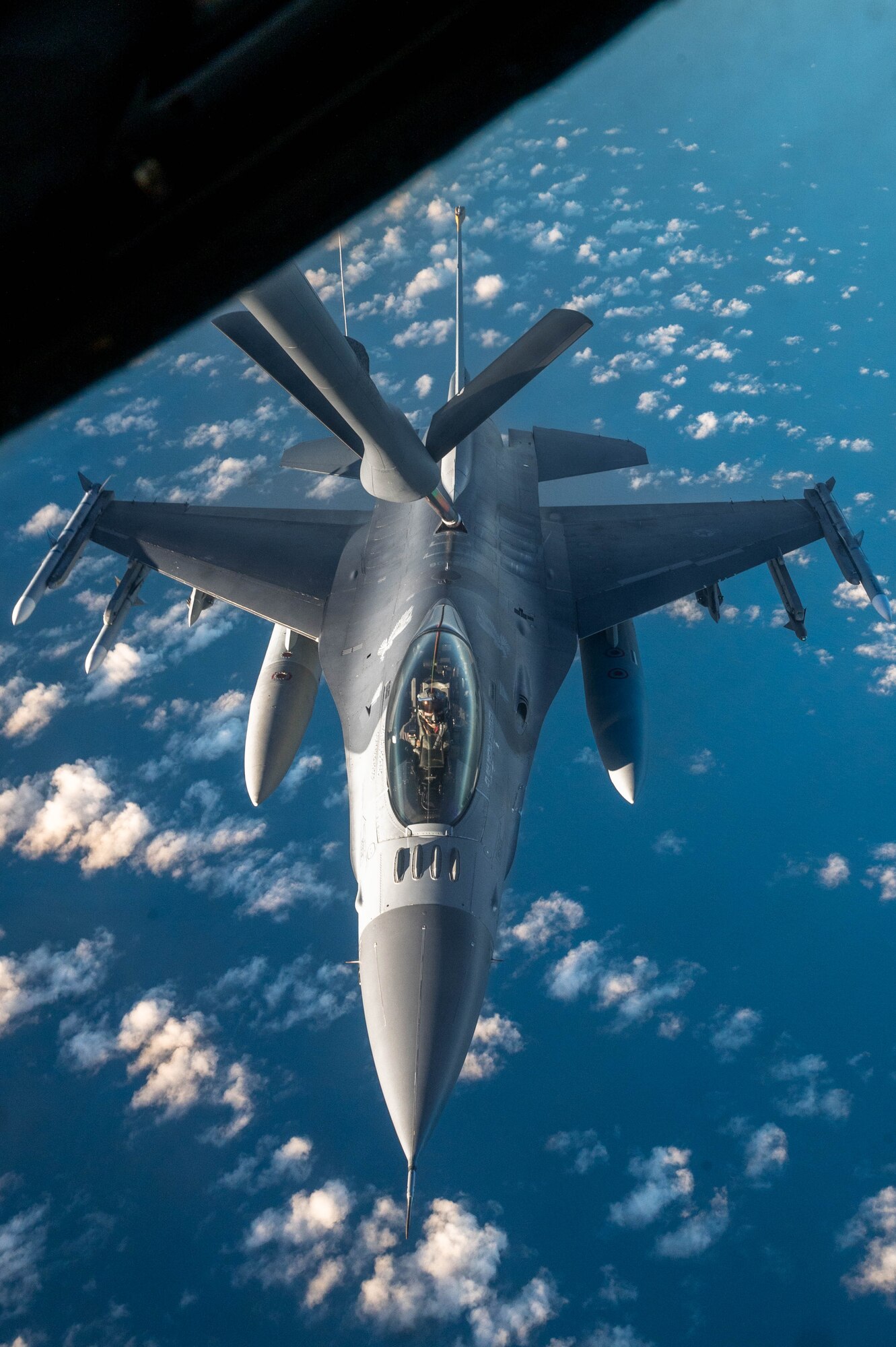 Airmen From Macdill Air Force Base, Florida refuel F-16 Fighting Falcons from Kadena Air Base, Japan in support of Mobility Guardian 2023 July 9th, 2023, over the Indo Pacific region. A multilateral endeavor, MG23 features seven participating countries - Australia, Canada, France, Japan, New Zealand, United Kingdom, and the United States - operating approximately 70 mobility aircraft across multiple locations spanning a 3,000 mile exercise area from July 5th through July 21. Our Allies and partners are one of our greatest strengths and a key strategic advantage. (U.S. Air Force photo by Shelby Rapert)