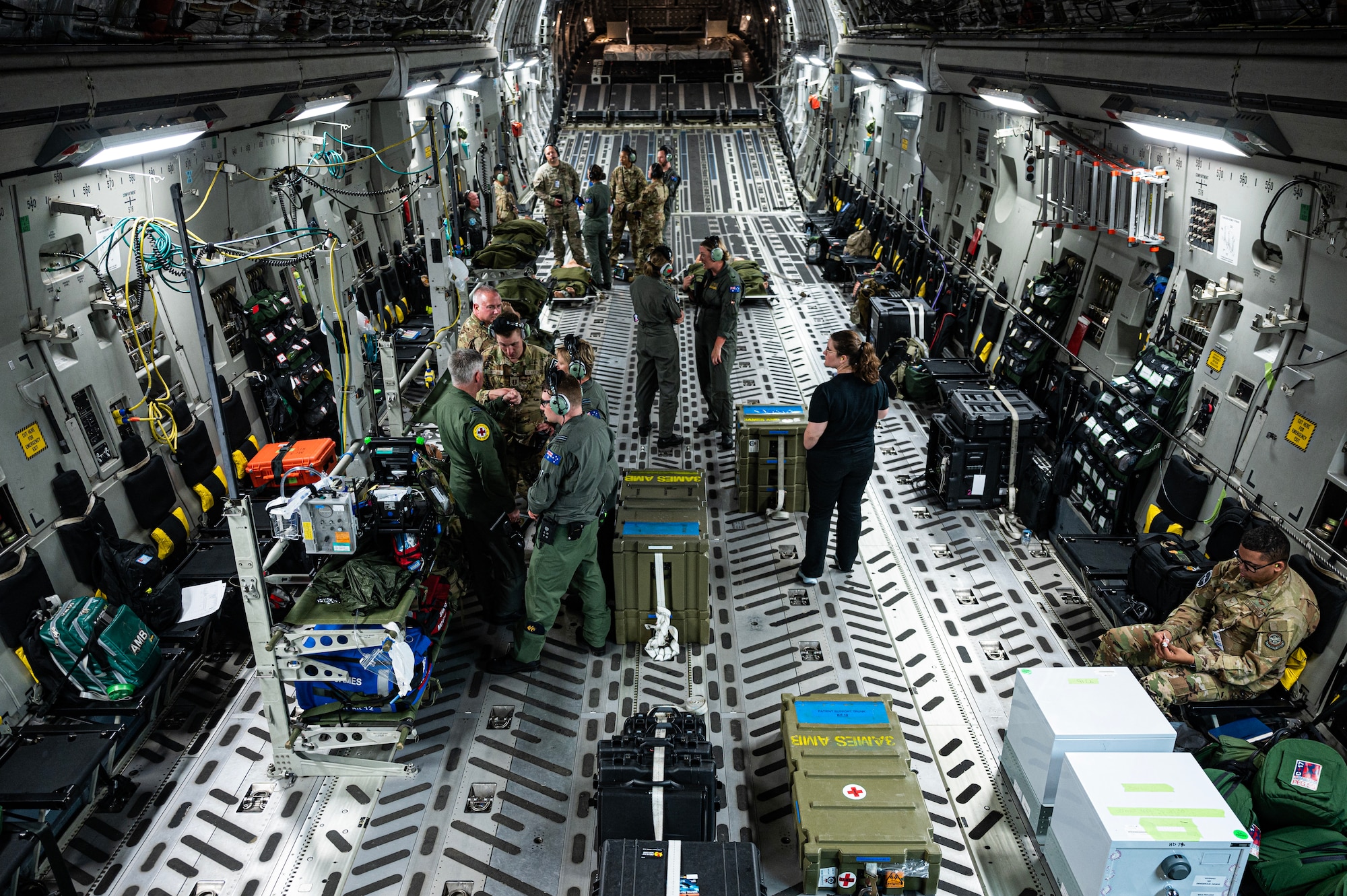 1st Sentence: Royal Australian Air Force Airmen, assigned to the 3 Aeromedical Evacuation Squadron, and U.S. Airmen assigned to the 375th AES train on a RAAF C-17 Globemaster III over the Indo-Pacific Region, July 10, 2023, for Exercise Mobility Guardian 2023. MG23 is an opportunity to train alongside our Allies and partners to demonstrate interoperability and bolster our collective ability to support a free and open Indo-Pacific. (U.S. Air Force photo by Staff Sgt. Devin M. Rumbaugh)