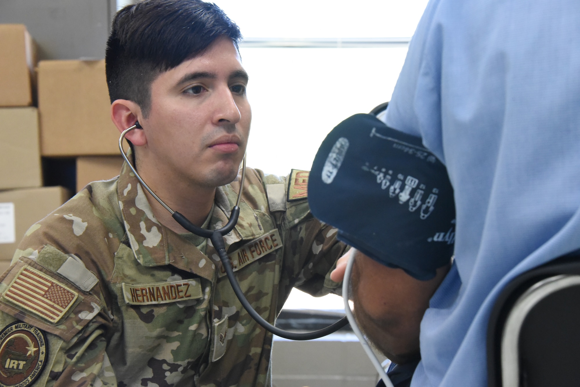 U.S. Air National Guard Senior Airman Chrissmiguel Hernandez, a 185th Air Refueling Wing Medical Group aerospace medical technician, measures blood pressure.