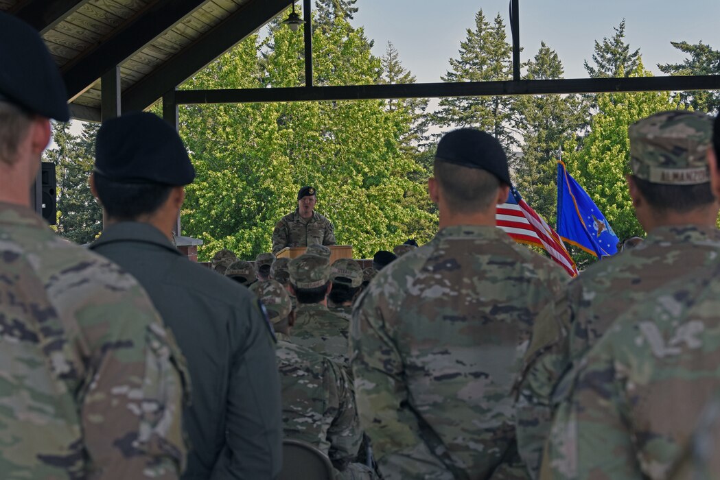 U.S. Air Force Maj. Daniel Lambert, incoming 627th Security Forces Squadron commander, gives remarks to attendees at the 627th SFS change of command ceremony at Joint Base Lewis-McChord, Washington, July 20, 2023. The mission of the 627th SFS is to defend the McChord Field flightline, execute Phoenix Raven flyaway security operations in support of U.S. Transportation Command, and lead combat arms training for JBLM Airmen. (U.S. Air Force photo by Staff Sgt. Zoe Thacker)