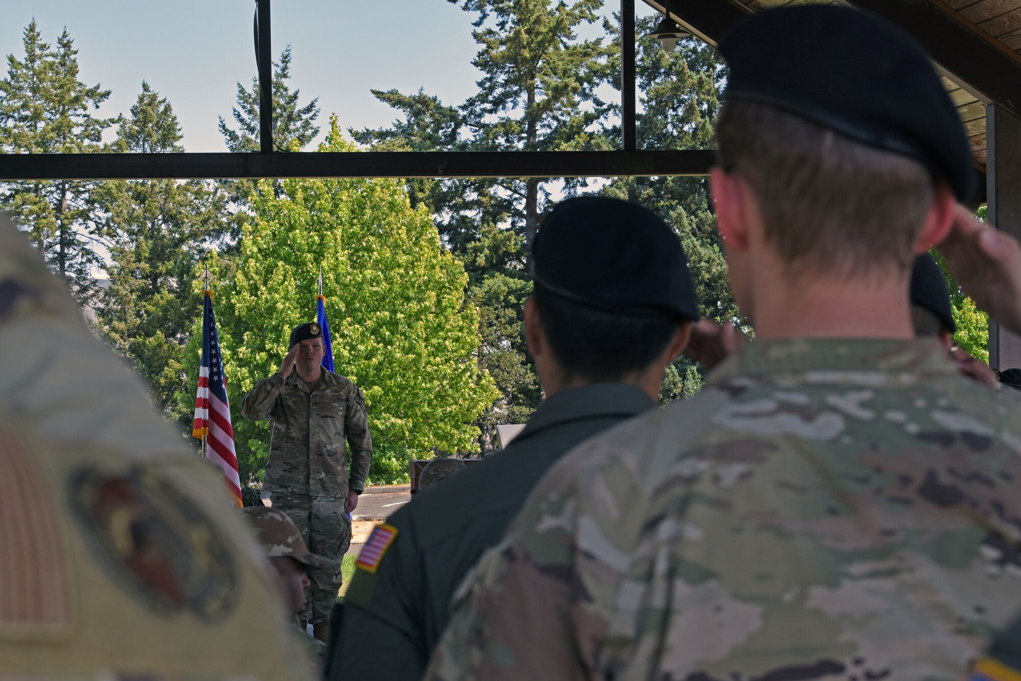 U.S. Air Force Maj. Daniel Lambert, incoming 627th Security Forces Squadron commander, gives remarks to attendees at the 627th SFS change of command ceremony at Joint Base Lewis-McChord, Washington, July 20, 2023. The mission of the 627th SFS is to defend the McChord Field flightline, execute Phoenix Raven flyaway security operations in support of U.S. Transportation Command, and lead combat arms training for JBLM Airmen. (U.S. Air Force photo by Staff Sgt. Zoe Thacker)