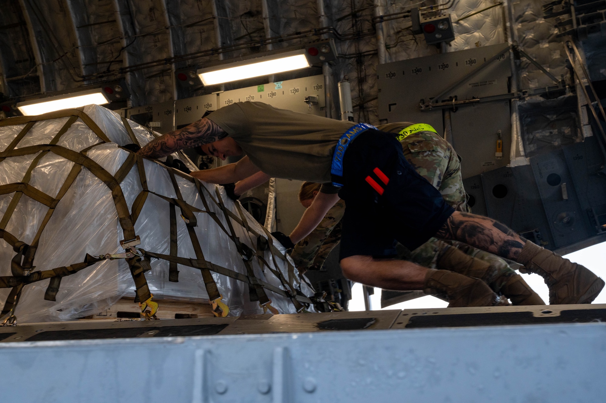 U.S. Air Force Airmen assigned to the 730th Air Mobility Squadron load cargo onto a C-17 Globemaster III assigned to Travis Air Force Base, California, at Yokota Air Base, Japan, July 13, 2023, in support of Mobility Guardian 2023. A multilateral endeavor, MG23 features seven participating countries-Australia, Canada, France, Japan, New Zealand, United Kingdom and the United States- operating approximately 70 mobility aircraft across multiple locations spanning a 3,000 miles exercise area from 5 July through 21 July. Our Allies and partners are one of our greatest strengths and a key strategic advantage. MG23 is an opportunity to deepen our connections with regional Allies and partners using bold initiatives.(U.S. Air Force photo by Airman 1st Class Shelby Rapert)