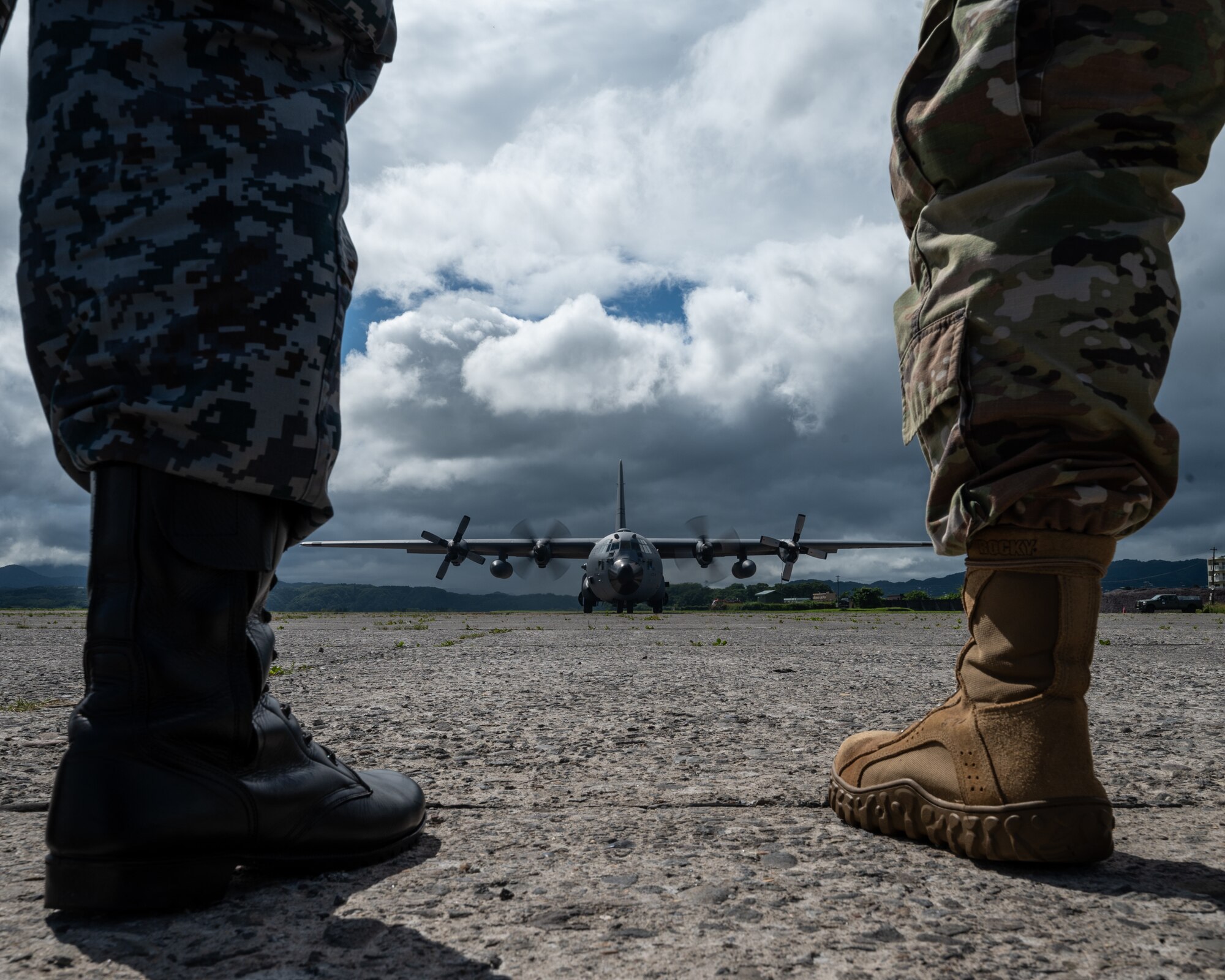 U.S. Air Force and Japanese Air Self Defense Force Airmen wait for the departure of a  C-130 Hercules from Yakumo Air Base, Japan July 13, 2023, in support of Mobility Guardian 2023 during a site visit to Yakumo Air Base, Japan July 13, 2023, in support of Mobility Guardian 2023.A multilateral endeavor, MG23 features seven participating countries – Australia, Canada, France, Japan, New Zealand, United Kingdom, and the United States – operating approximately 70 mobility aircraft across multiple locations spanning a 3,000 mile exercise area from July 5th through July 21. Our Allies and partners are one of our greatest strengths and a key strategic advantage. MG23 is an opportunity to deepen our connections with regional Allies and partners using bold initiatives. (U.S. Air Force photo by Tech. Sgt. Alexander Cook)