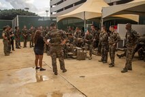 French soldiers with 2nd Company, Pacific Marine Infantry Regiment-French Polynesia, receive a brief on shallow water egress training (SWET) at Marine Corps Base Hawaii, July 13, 2023. The visit provided bilateral training between the French army and U.S. Marines, enhancing interoperability and strengthening relationships between the two militaries. (U.S. Marine Corps  photo by Sgt. Julian Elliott-Drouin)