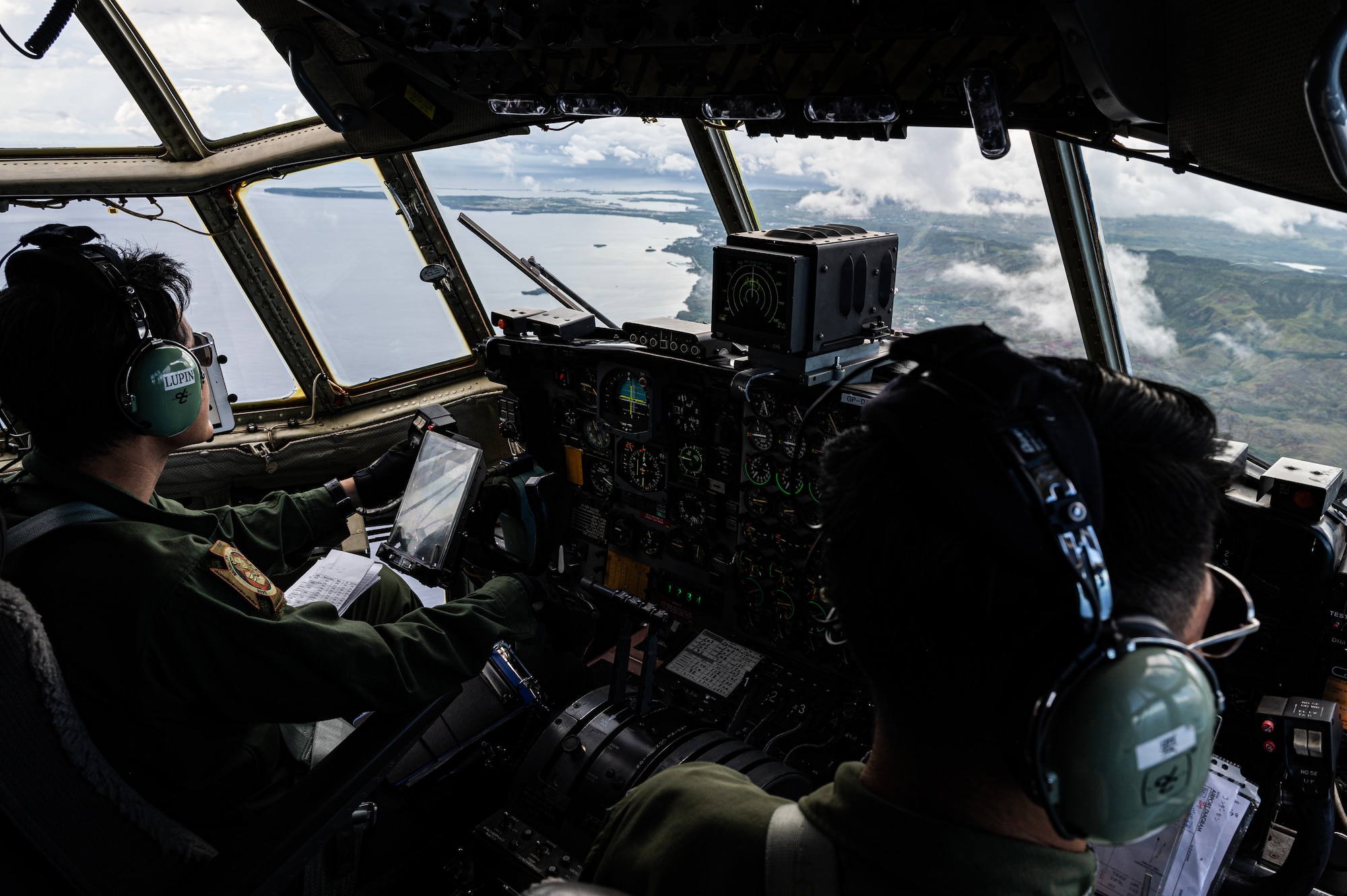 Japan Air Self-Defense Force C-130H Hercules pilots assigned to the 401st Tactical Airlift Squadron, fly a C-130H in a coalition airdrop mission over Tinian, July 12, 2023, for Mobility Guardian 23. MG23 is an opportunity to train alongside our Allies and 
partners to demonstrate interoperability and bolster our collective ability to support a free and open Indo-Pacific. (U.S. Air Force photo by Staff Sgt. Devin M. Rumbaugh)