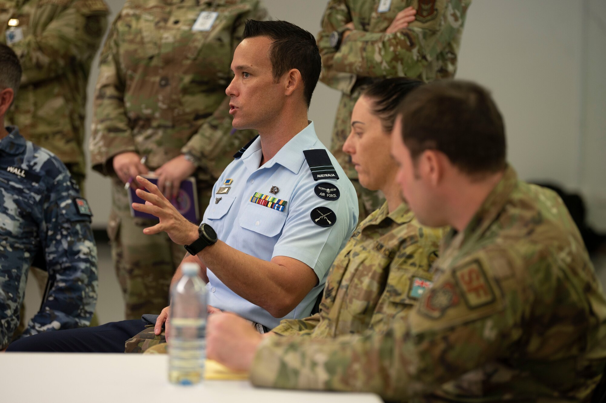 A Royal Australian Air Force aviator briefs during an emergency management briefing at RAAF Darwin, Australia, July 10, 2023. 3,000 personnel directly supported the large-scale mobility exercise, which provided the maneuver of more than 15,000 U.S. and international forces associated with other exercises across the Indo-Pacific held in the same timeframe. (U.S. Air Force photo by Tech. Sgt. Heather Clements)