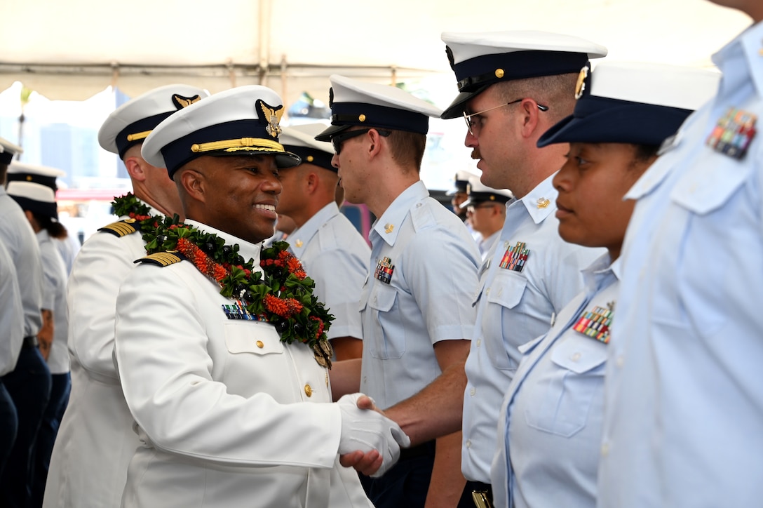 Capt. Willie Carmichael and Capt. Matthew Rooney conduct a personnel inspection during the Coast Guard Cutter Midgett’s (WMSL 757) change of command ceremony on Base Honolulu, July 20, 2023. Rear Adm. Brendan C. McPherson, deputy commander of U.S. Coast Guard Pacific Area, presided over the ceremony in which Rooney relieved Carmichael as Midgett’s commanding officer. U.S. Coast Guard photo by Chief Petty Officer Matthew Masaschi.