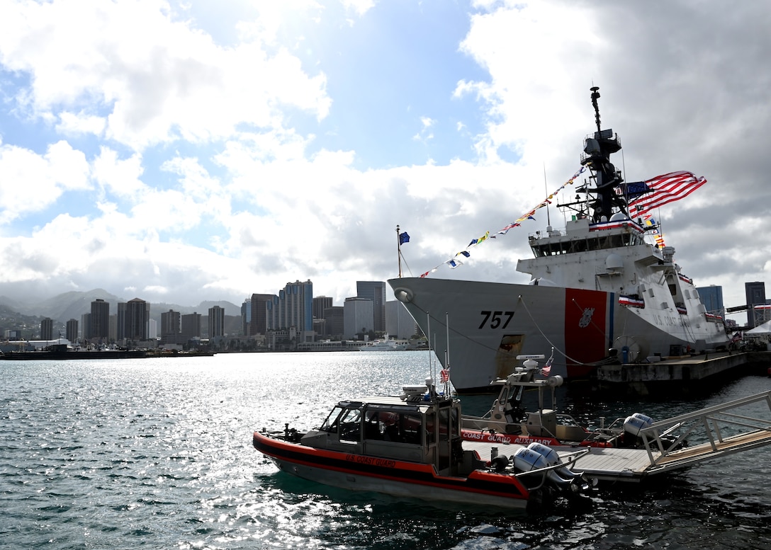 The U.S. Coast Guard Cutter Midgett (WMSL 757) is moored in full dress ship at U.S. Coast Guard Base Honolulu ahead of the cutter’s change of command ceremony, July 20, 2023. Rear Adm. Brendan C. McPherson, deputy commander of U.S. Coast Guard Pacific Area, presided over the ceremony in which Capt. Matthew Rooney relieved Capt. Willie Carmichael as Midgett’s commanding officer. U.S. Coast Guard photo by Chief Petty Officer Matthew Masaschi.