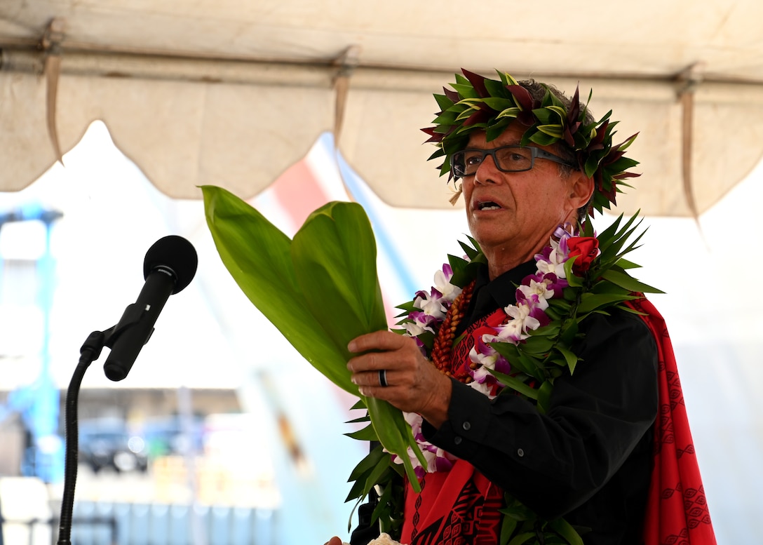 Kahu Kimo Taylor delivers a blessing during the U.S. Coast Guard Cutter Midgett’s (WMSL 757) change of command ceremony on Base Honolulu, July 20, 2023. Rear Adm. Brendan C. McPherson, deputy commander of U.S. Coast Guard Pacific Area, presided over the ceremony in which Capt. Matthew Rooney relieved Capt. Willie Carmichael as Midgett’s commanding officer. U.S. Coast Guard photo by Chief Petty Officer Matthew Masaschi.