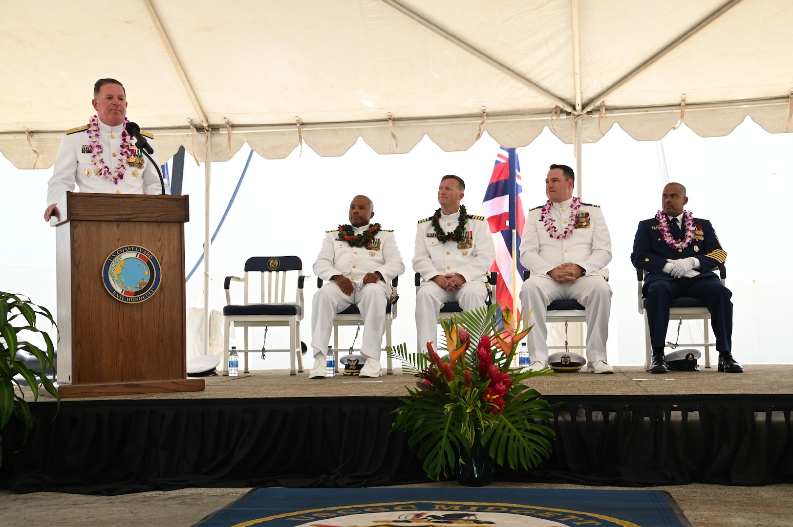 Rear Adm. Brendan C. McPherson, deputy commander of U.S. Coast Guard Pacific Area, speaks during the U.S. Coast Guard Cutter Midgett’s (WMSL 757) change of command ceremony on Coast Guard Base Honolulu, July 20, 2023. McPherson presided over the ceremony in which Capt. Matthew Rooney relieved Capt. Willie Carmichael as Midgett’s commanding officer. U.S. Coast Guard photo by Chief Petty Officer Matthew Masaschi.