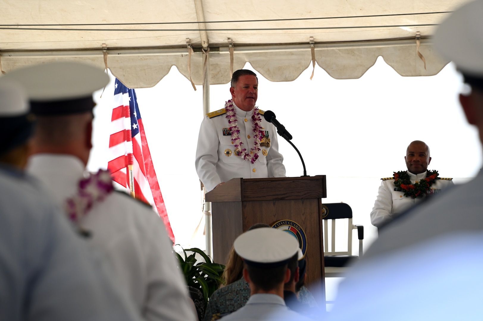 Rear Adm. Brendan C. McPherson, deputy commander of U.S. Coast Guard Pacific Area, speaks during the U.S. Coast Guard Cutter Midgett’s (WMSL 757) change of command ceremony on Coast Guard Base Honolulu, July 20, 2023. McPherson presided over the ceremony in which Capt. Matthew Rooney relieved Capt. Willie Carmichael as Midgett’s commanding officer. U.S. Coast Guard photo by Chief Petty Officer Matthew Masaschi.