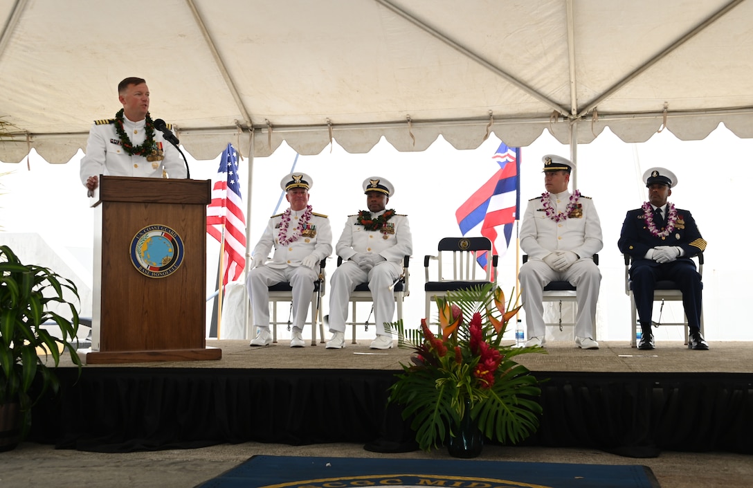 Capt. Matthew Rooney speaks during the U.S. Coast Guard Cutter Midgett’s (WMSL 757) change of command ceremony on Coast Guard Base Honolulu, July 20, 2023. Rear Adm. Brendan C. McPherson, deputy commander of U.S. Coast Guard Pacific Area, presided over the ceremony in which Rooney relieved Capt. Willie Carmichael as Midgett’s commanding officer. U.S. Coast Guard photo by Chief Petty Officer Matthew Masaschi.