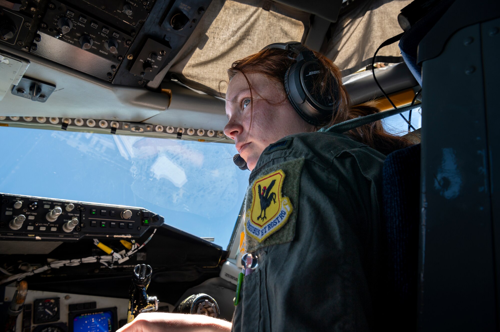 U.S. Air Force 1st Lt. Arica Snodgrass, 909th Air Refueling Squadron pilot, reviews her pre-flight checklist in a KC-135 Stratotanker at Kadena Air Base, Japan, July 19, 2023.