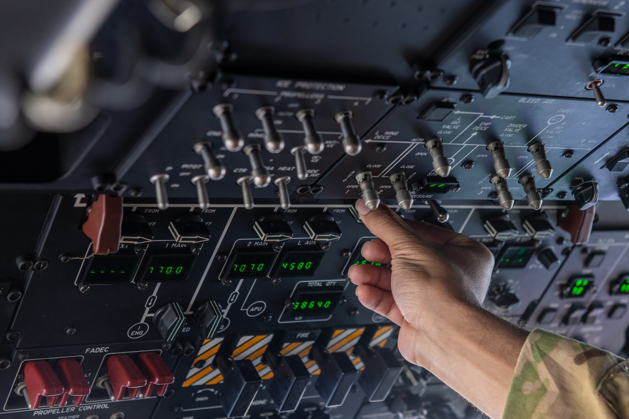 A hand adjusts buttons