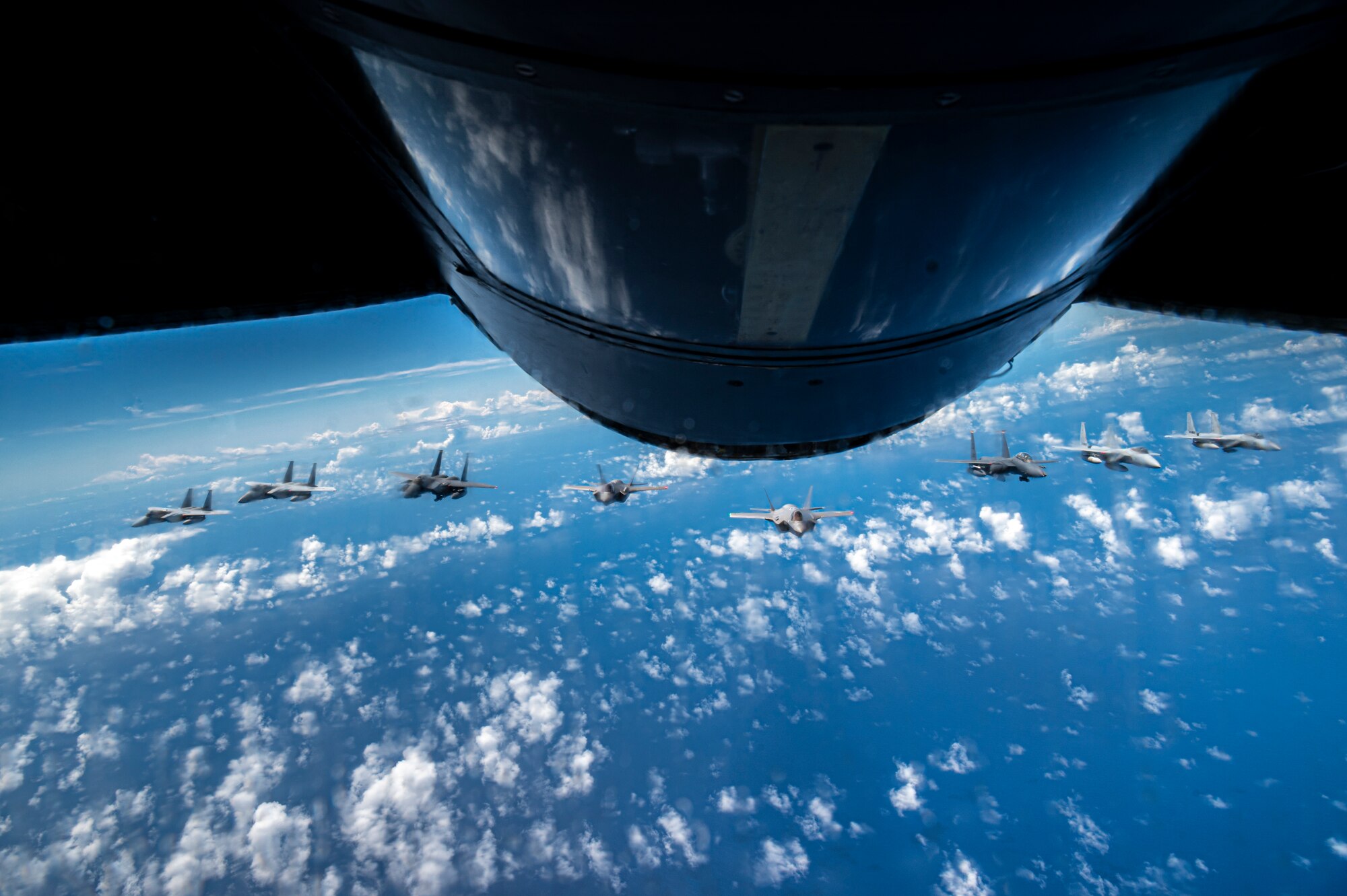 Two U.S. Air Force F-15E Strike Eagles and two F-35A Lightning IIs join four Japan Air Self-Defense Force F-15 Eagles over the Sea of Japan, July 19, 2023.