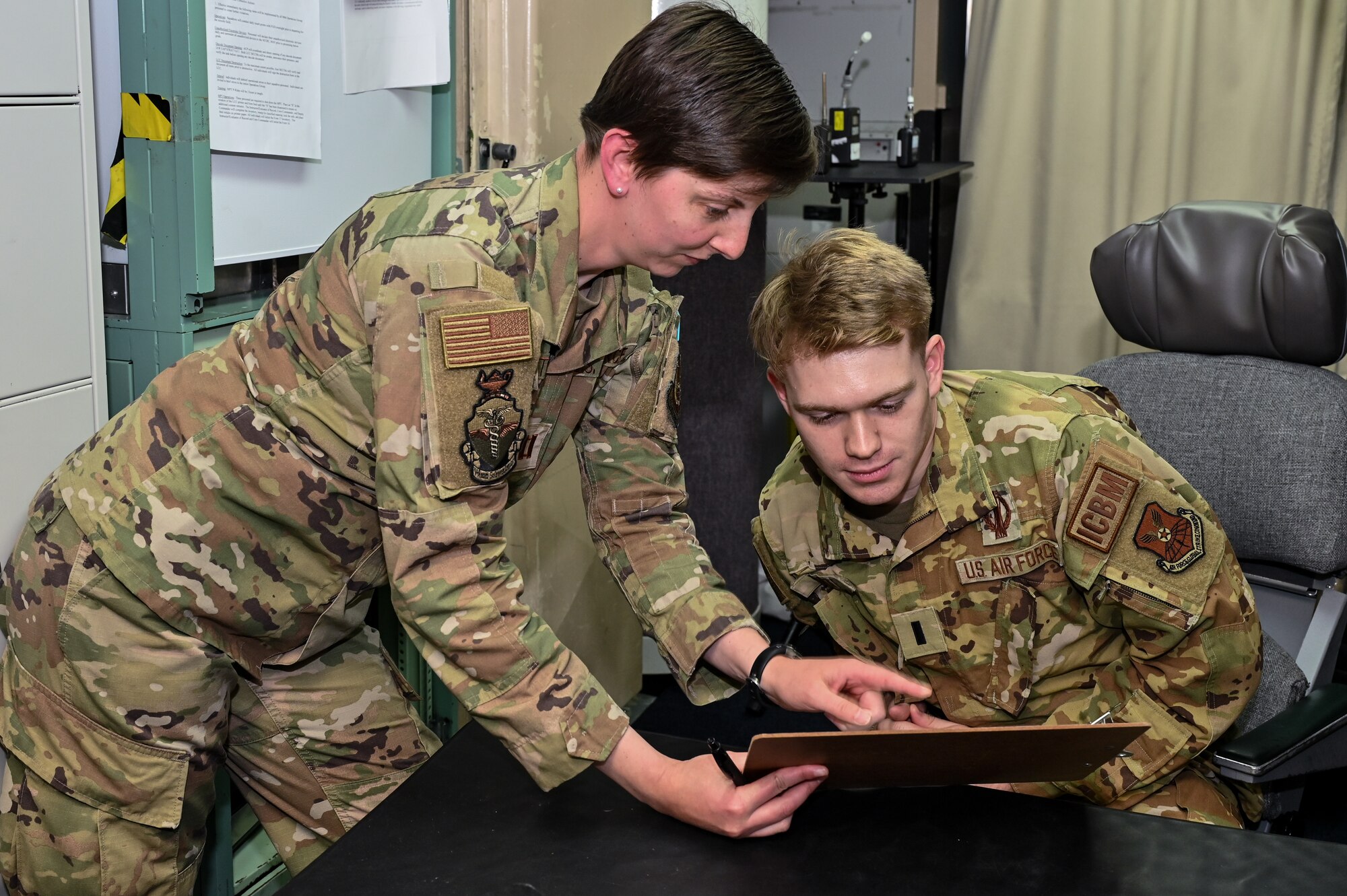 Capt. Isabella Muffoletto, U.S. Air Force School of Aerospace Medicine bioenvironmental engineer, explains the different tests to 1st Lt. Nikolai Voinoff, 321st Missile Squadron combat crew commander, at L-01 missile alert facility, or MAF, near Stoneham, Colorado, July 13, 2023. USAFSAM teams visited all of F.E. Warren Air Force Base’s MAFs as part of the ongoing missile community cancer study at all three intercontinental ballistic missile wings in Air Force Global Strike Command. While there, the teams assessed indoor air quality at each facility to include temperature, humidity, carbon dioxide and carbon monoxide levels. They also collected water and soil samples and tested for the presence of radon, polychlorinated biphenyls, organic phosphates and other potential occupational exposure hazards. USAFSAM is part of the Air Force Research Laboratory’s 711th Human Performance Wing. (U.S. Air Force photo by Joseph Coslett Jr.)