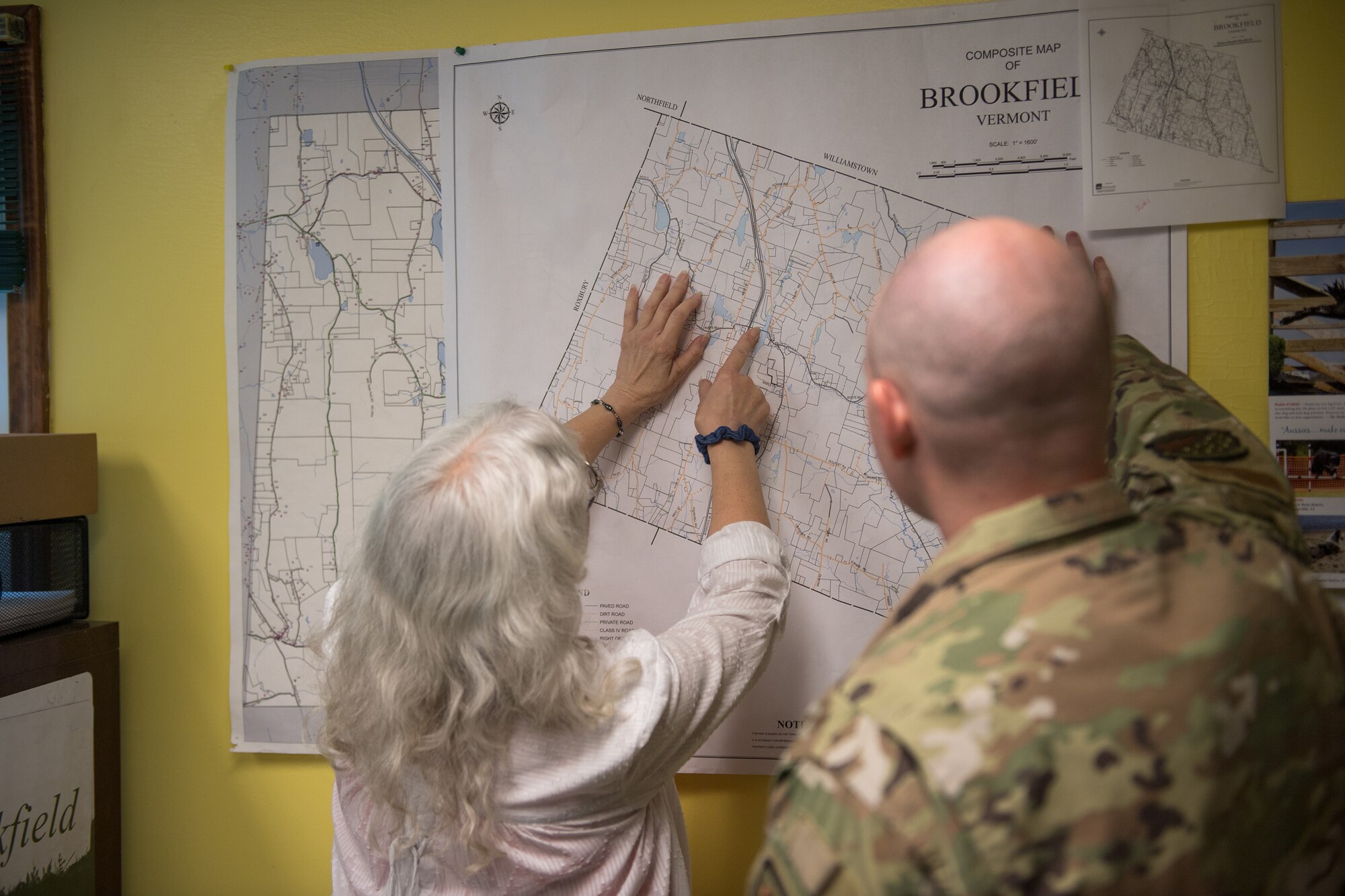 Brookfield Vermont town treasurer, Amy Ingrassia, points to sections of a map that were recently impacted by historic Vermont flooding at Brookf