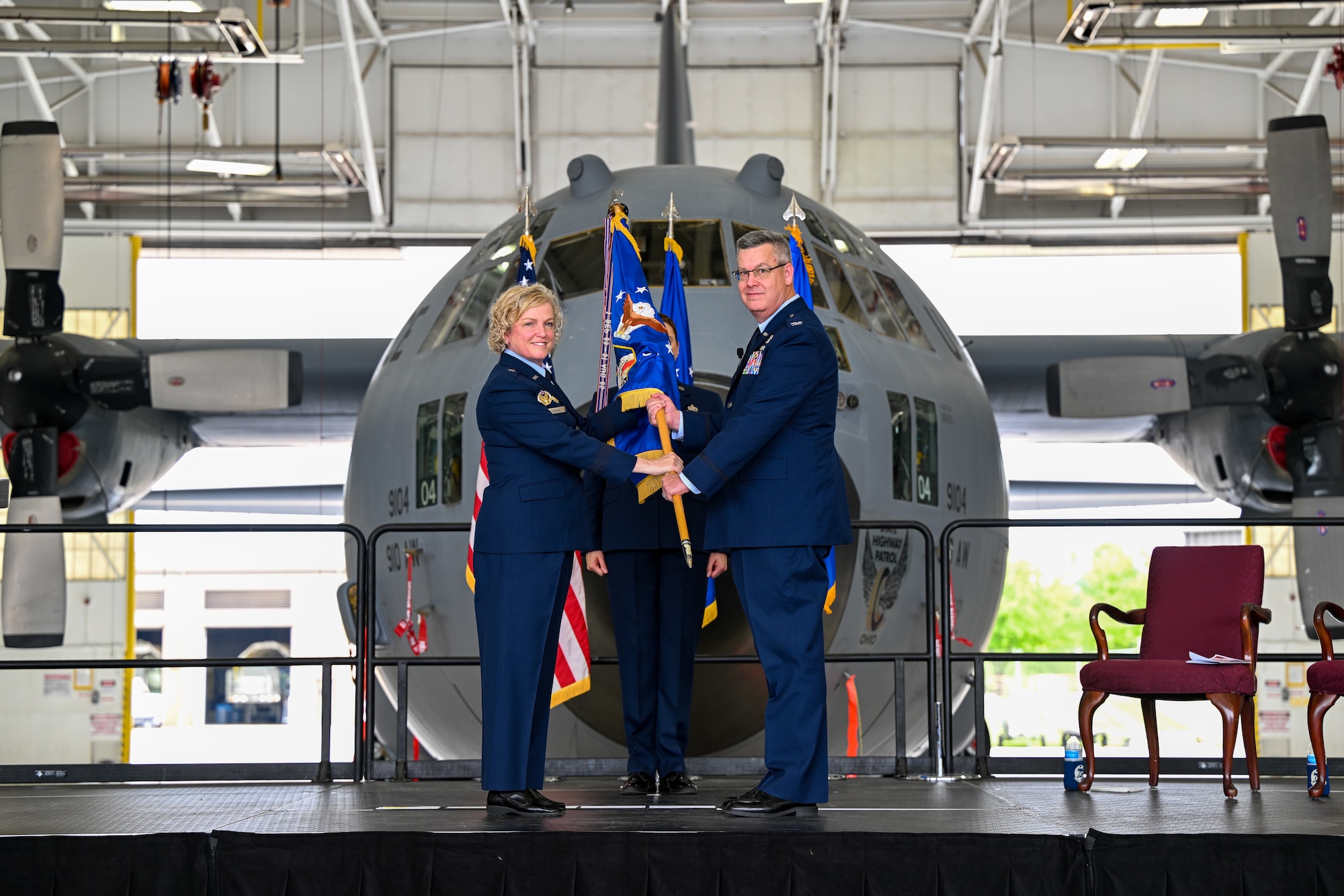 Col. Michael Maloney, 910th Airlift Wing commander, accepts the wing's flag from Brig. Gen. Melissa Coburn, 22nd Air Force commander, during his assumption of command ceremony, July 15, 2023, at Youngstown Air Reserve Station, Ohio.