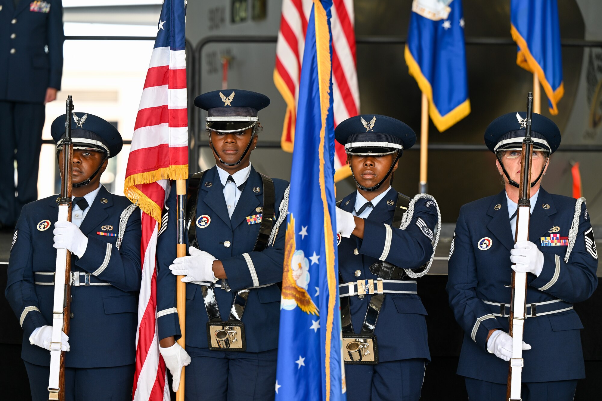 Members of the 910th Airlift Wing base color guard present the colors during the national anthem to begin the wing's assumption of command ceremony, July 15, 2023, at Youngstown Air Reserve Station, Ohio.