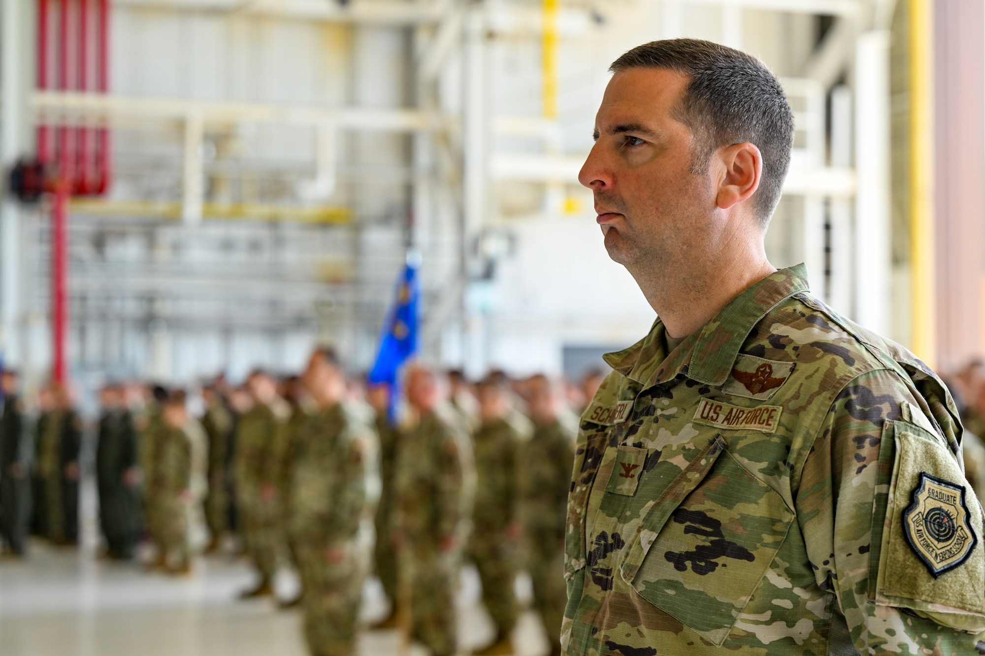 Col. Ed Schierberl, 910th Airlift Wing vice commander, stands at parade rest as the commander of troops at the beginning of the wing's assumption of command ceremony, July 15, 2023, at Youngstown Air Reserve Station, Ohio