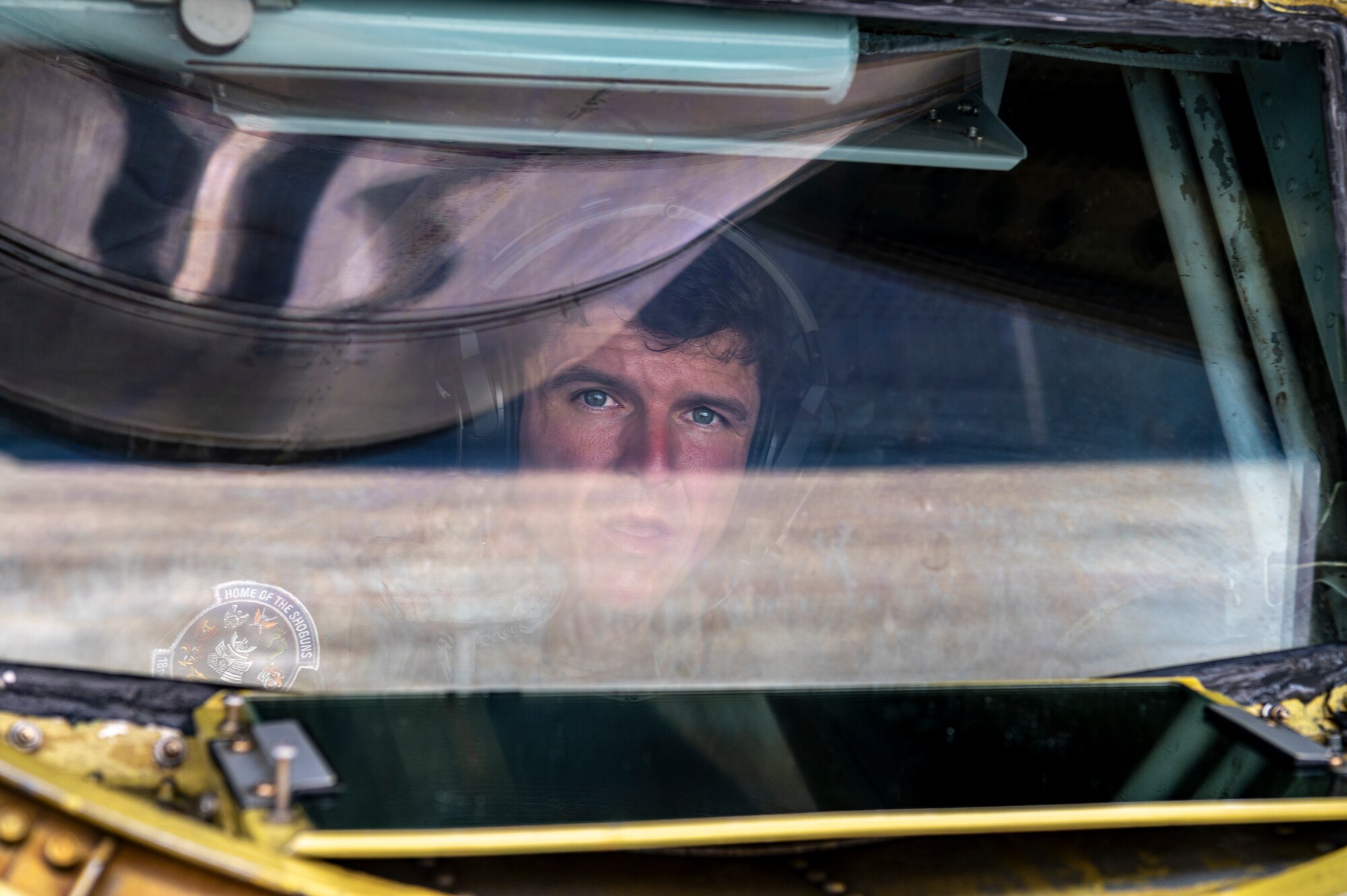 U.S. Air Force Master Sgt. Jason Duckett, 909th Air Refueling Squadron boom operator, performs pre-flight checks in a KC-135 Stratotanker at Kadena Air Base, Japan, July 19, 2023.