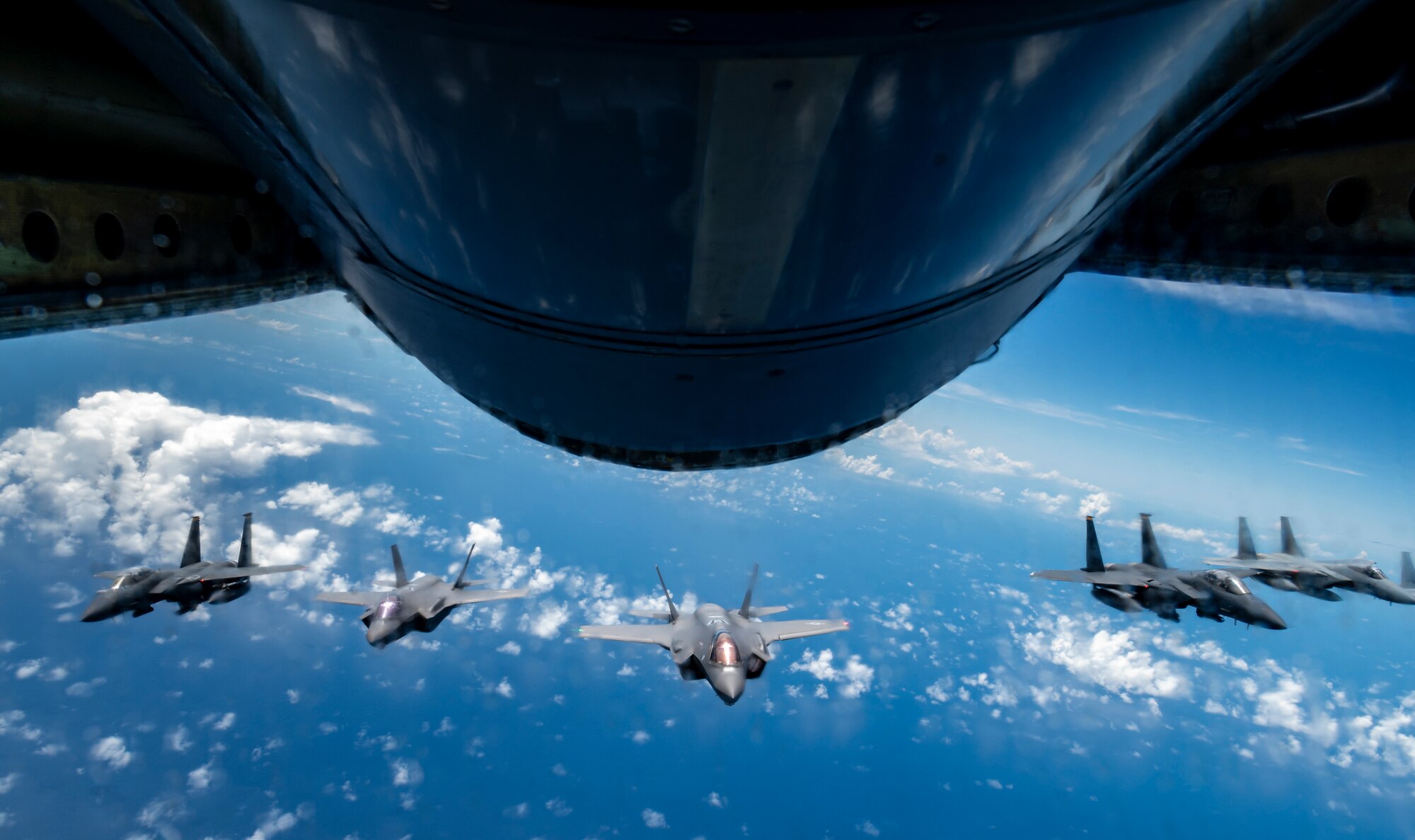 Two U.S. Air Force F-15E Strike Eagles and two F-35A Lightning IIs join four Japan Air Self-Defense Force F-15 Eagles over the Sea of Japan, July 19, 2023.