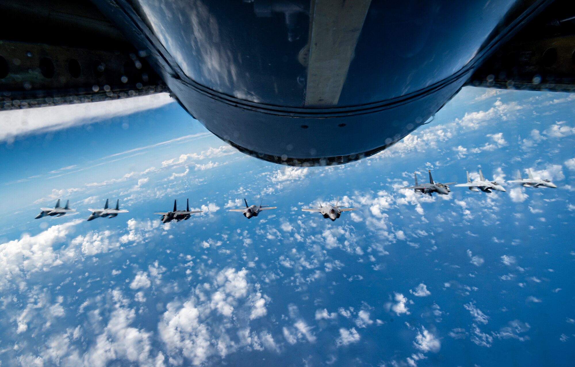 Two U.S. Air Force F-15E Strike Eagles and two F-35A Lightning IIs join four Japan Air Self-Defense Force F-15 Eagles over the Sea of Japan, July 19, 2023.