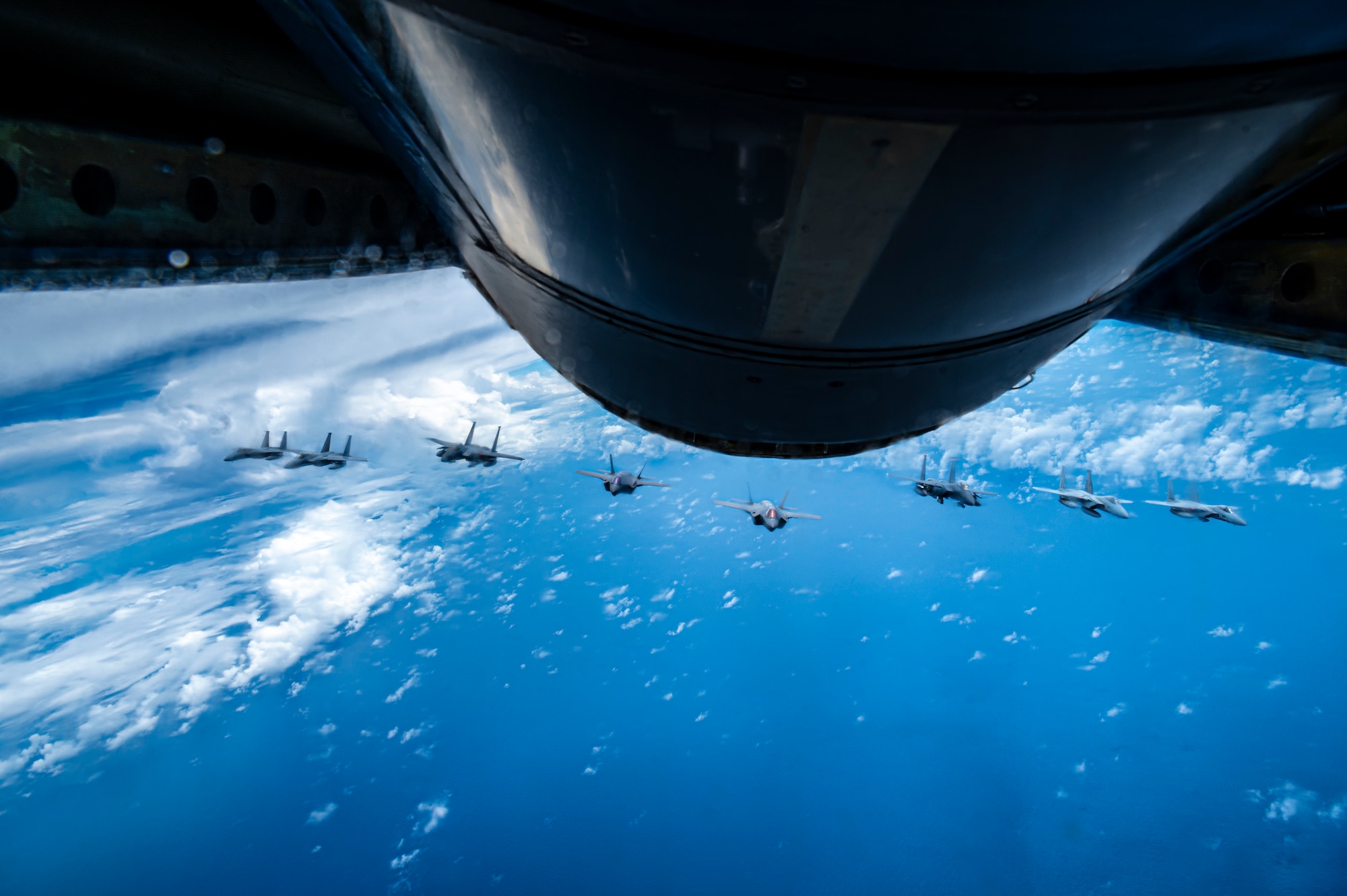 Two U.S. Air Force F-15E Strike Eagles and two F-35A Lightning IIs join four Japan Air Self-Defense Force F-15 Eagles over the Sea of Japan, July 19, 2023.