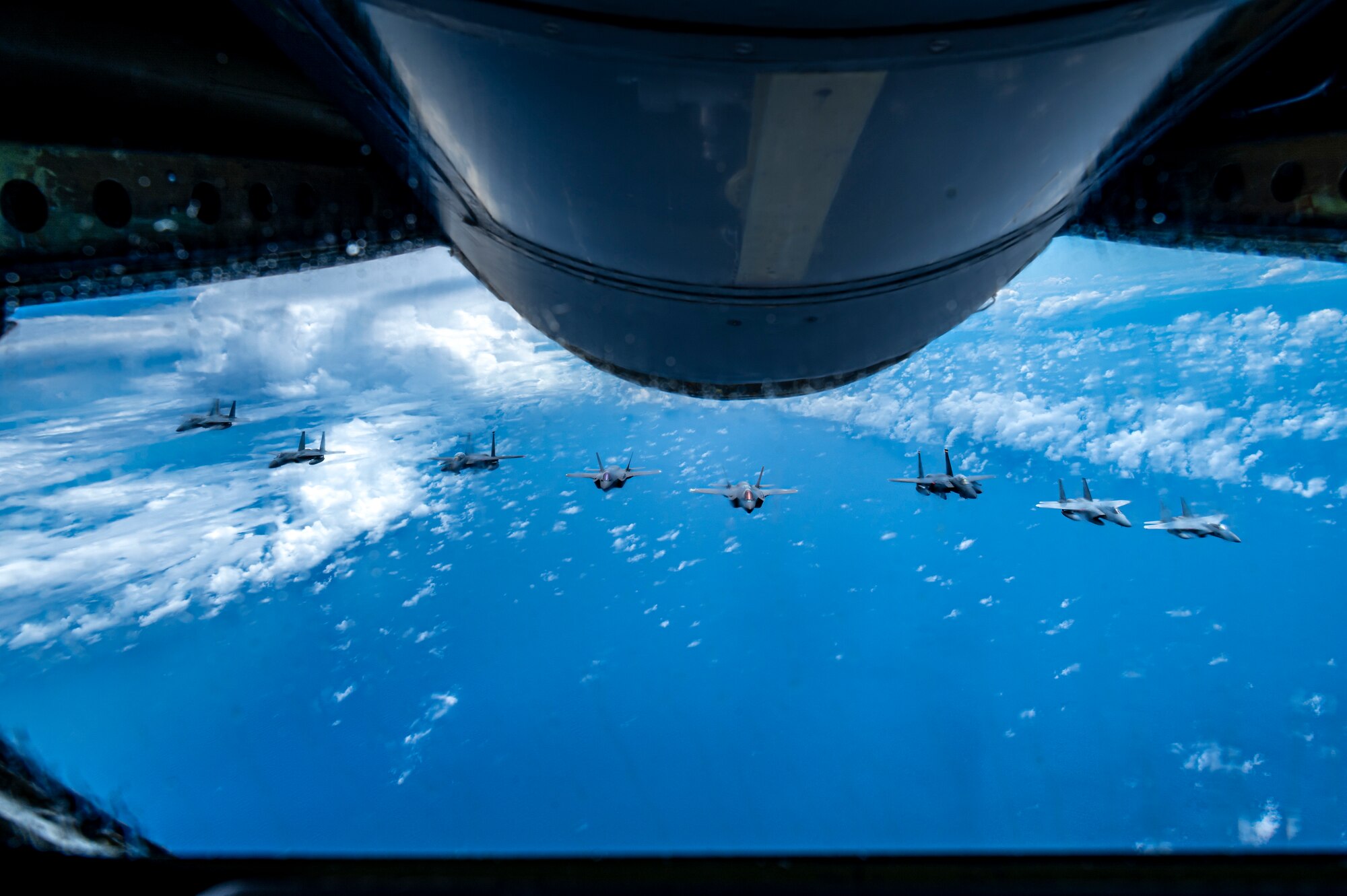 Two U.S. Air Force F-15E Strike Eagles and two F-35A Lightning IIs join four Japan Air Self-Defense Force F-15 Eagles over the Sea of Japan, July 19, 2023.