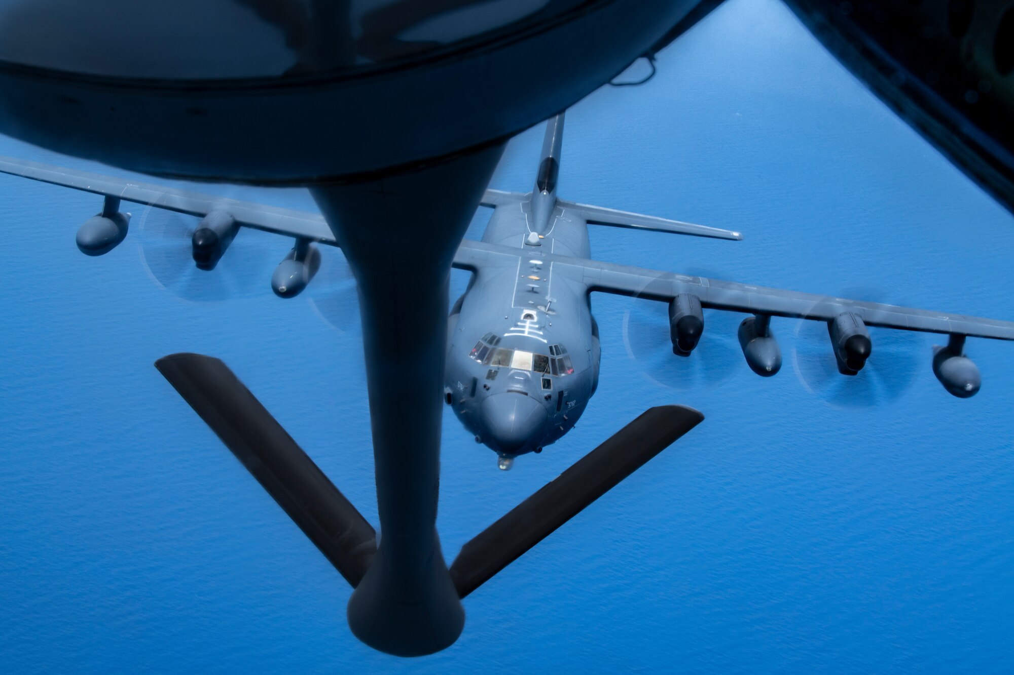 A U.S. Air Force MC-130J Commando II aircraft assigned to the 1st Special Operations Squadron approaches a KC-135 Stratotanker from the 909th Air Refueling Squadron to receive fuel over the Pacific Ocean, July 19, 2023.