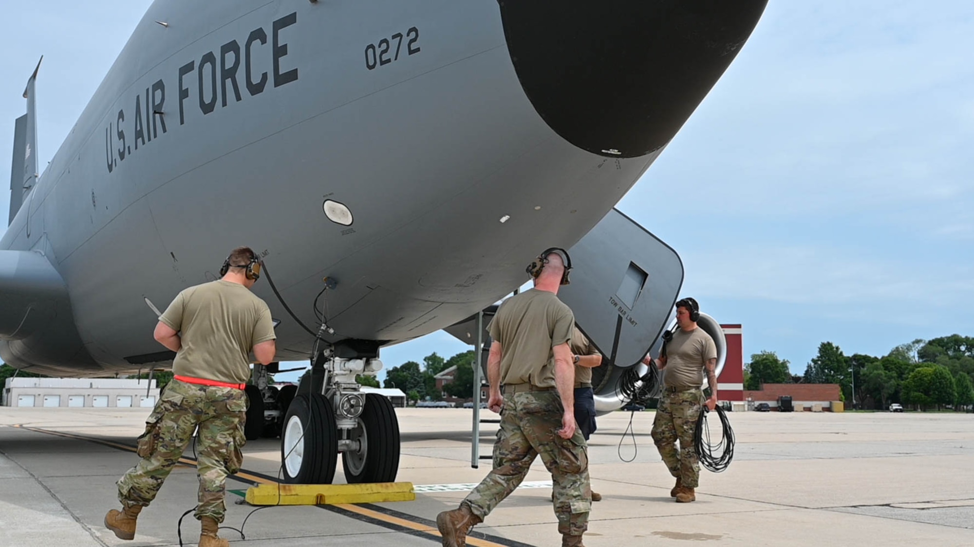 Airmen from the 127th Logistics Readiness Squadron and 434th Aircraft Maintenance Squadron pack up equipment and do final checks after a hot refueling of a KC-135R Stratotanker, July 12, 2023, at Selfridge Air National Guard Base, Michigan. Hot refueling allows an aircraft’s engines to remain running while being refueled, increasing the capabilities of aircraft to land anywhere, refuel and take-off much faster. (U.S. Air Force Photo by Amn Elise Faurote)