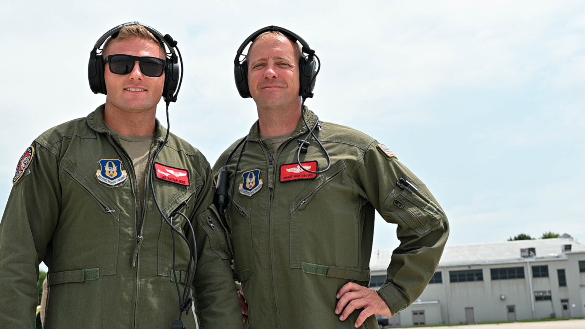 Tech. Sgt. Nathan Geist, left, and Senior Master Sgt. Nick Obusek, right, 74th Aerial Refueling Squadron boom operators, pose for a picture after the successful hot refueling of a KC-135R Stratotanker, July 12, 2023, at Selfridge Air National Guard Base, Michigan. Hot refueling allows an aircraft’s engines to remain running while being refueled, increasing the capabilities of aircraft to land anywhere, refuel and take-off much faster. (U.S. Air Force Photo by Amn Elise Faurote)