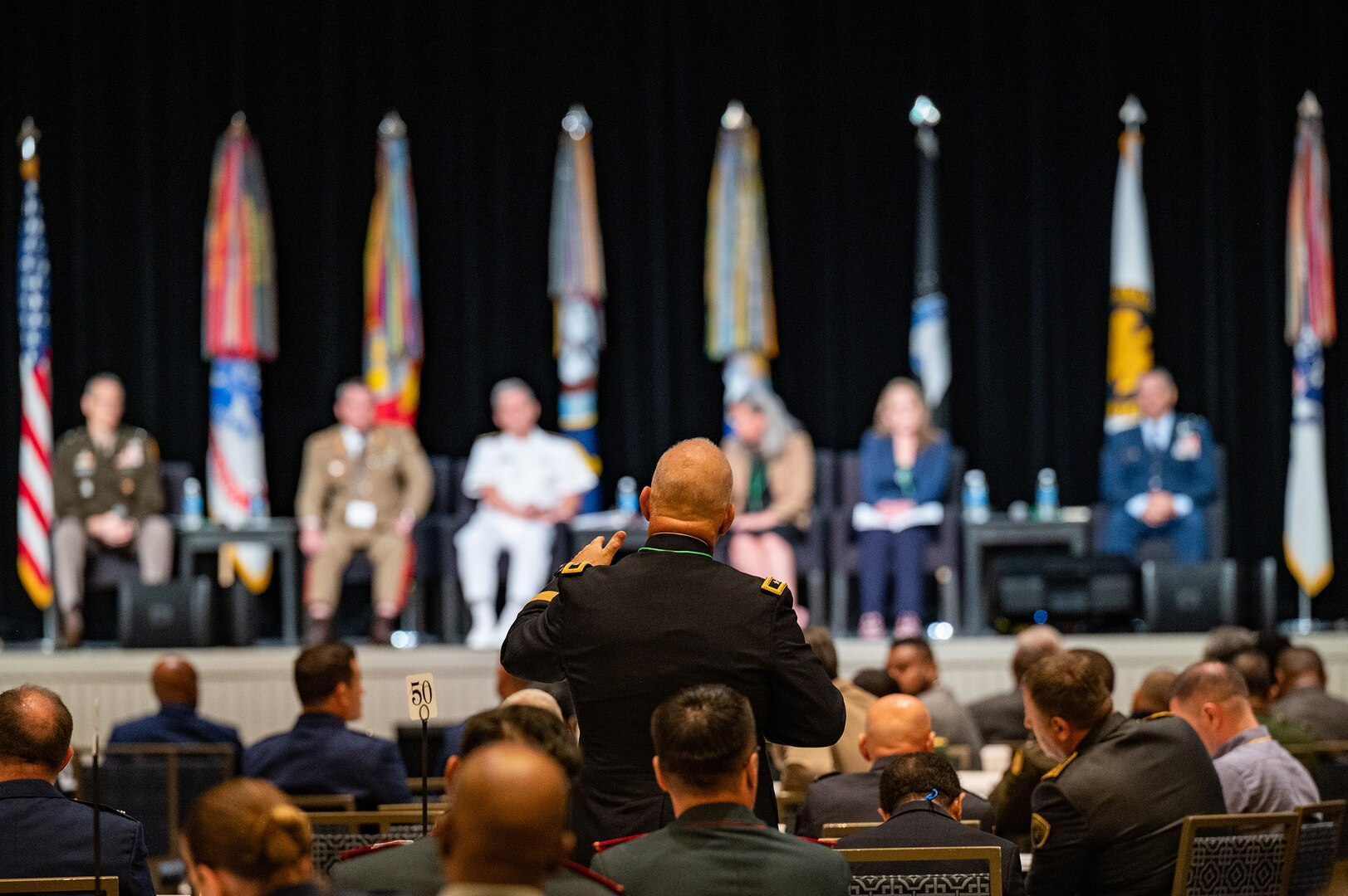 U.S. Army Maj. Gen. Christopher P. Callahan, adjutant general of the Rhode Island National Guard, poses a question for members of a panel highlighting the future of the Department of Defense National Guard State Partnership Program during the program’s 30th-anniversary conference at National Harbor, Maryland, July 18, 2023.