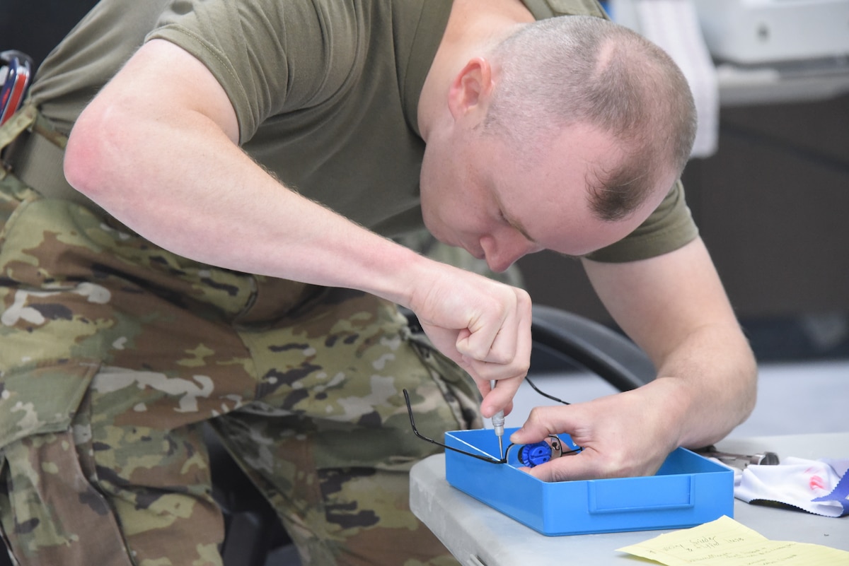 Photo of person preparing eyeglasses.