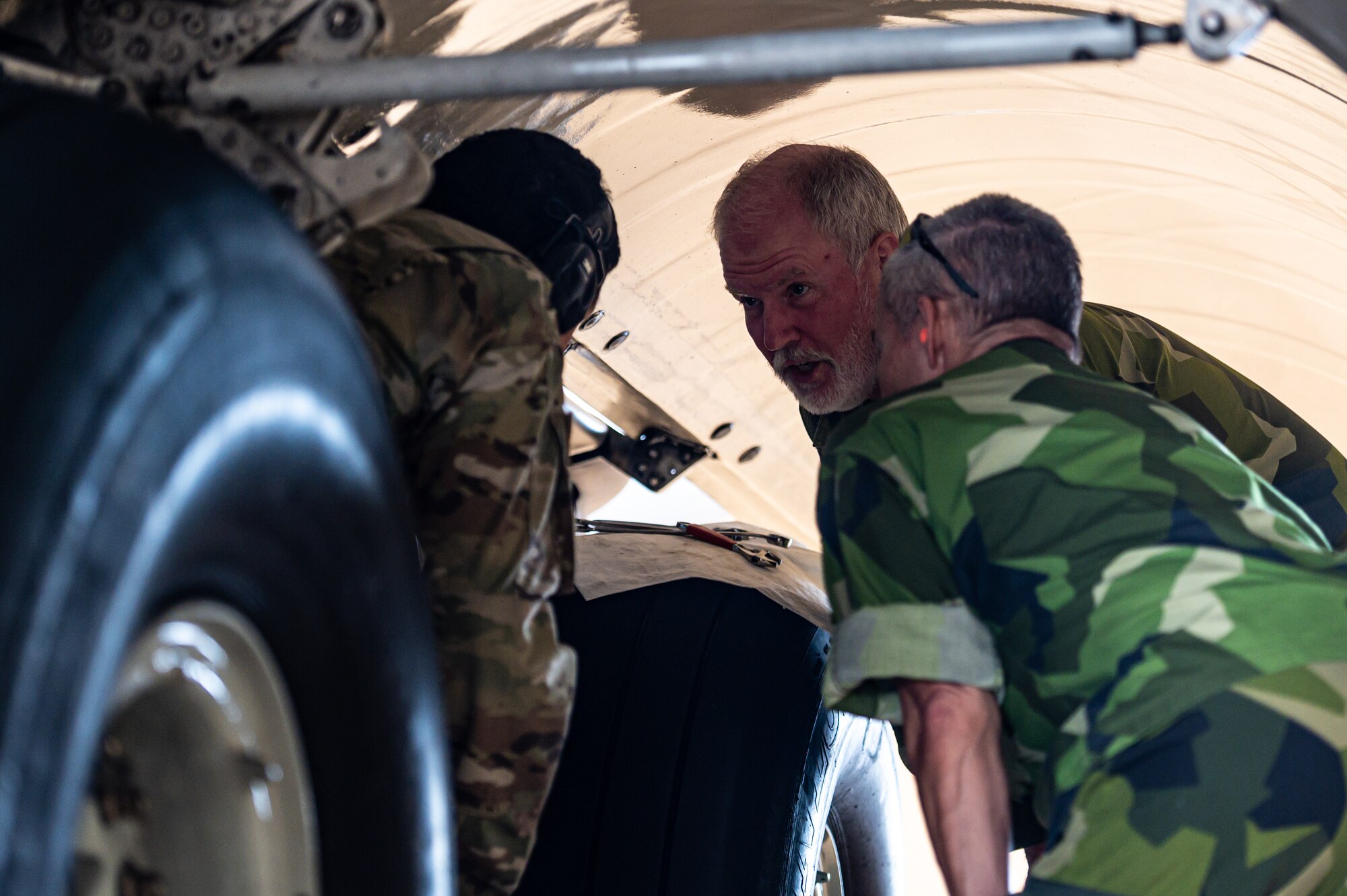 Members of the Swedish Air Force conduct hands-on training during the first C-17 Flying Crew Chief Strategic Airlift Capability Course held for international students at Joint Base McGuire-Dix-Lakehurst, N.J., July 17, 2023. The five-week course is intended to build interoperability between our allies and partners in an effort to bridge knowledge gaps in aircraft maintenance necessary for Rapid Global Mobility and meeting National Defense Strategy requirements. (U.S. Air Force photo by Senior Airman Sergio Avalos)