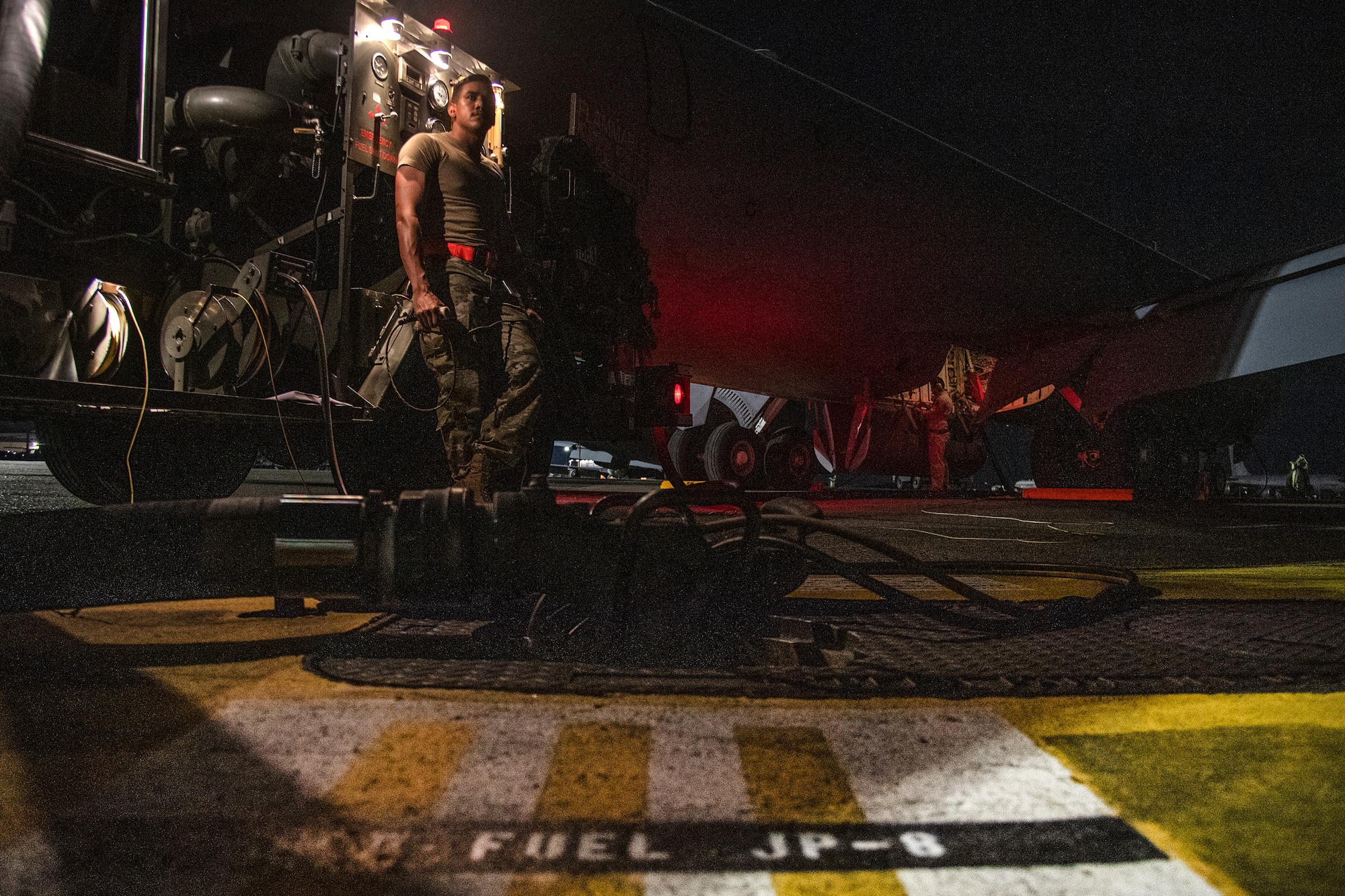 U.S. Air Force Airman 1st Class Juan Ortiz, 374th Logistics Readiness Squadron fuels distribution operator, works with Airmen assigned to the 6th Aircraft Maintenance Squadron, MacDill Air Force Base, Florida, to refuel a KC-135 Stratotanker in support of Mobility Guardian 2023 at Yokota Air Base, Japan, July 18, 2023.  A multilateral endeavor, MG23 features seven participating countries - Australia, Canada, France, Japan, New Zealand, United Kingdom, and the United States - Operating approximately 70 mobility aircraft across multiple locations spanning a 3,000 miles exercise are from July 5 through July 21. Our Allies and partners are one of our greatest strengths and a key strategic advantage. MG23 is an opportunity to deepen our connections with regional Allies and partners using bold initiatives. (U.S. Air Force photo by Tech. Sgt. Christopher Hubenthal)