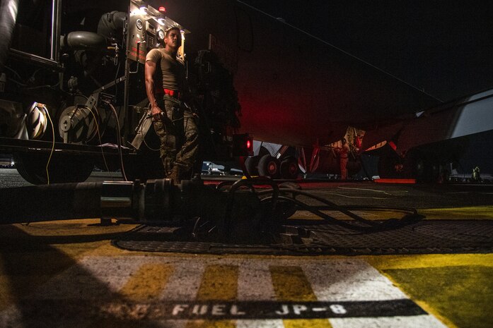 U.S. Air Force Airman 1st Class Juan Ortiz, 374th Logistics Readiness Squadron fuels distribution operator, works with Airmen assigned to the 6th Aircraft Maintenance Squadron, MacDill Air Force Base, Florida, to refuel a KC-135 Stratotanker in support of Mobility Guardian 2023 at Yokota Air Base, Japan, July 18, 2023.  A multilateral endeavor, MG23 features seven participating countries - Australia, Canada, France, Japan, New Zealand, United Kingdom, and the United States - Operating approximately 70 mobility aircraft across multiple locations spanning a 3,000 miles exercise are from July 5 through July 21. Our Allies and partners are one of our greatest strengths and a key strategic advantage. MG23 is an opportunity to deepen our connections with regional Allies and partners using bold initiatives. (U.S. Air Force photo by Tech. Sgt. Christopher Hubenthal)