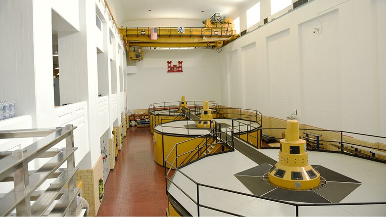 Three power generating turbines housed in the power plant are pictured.