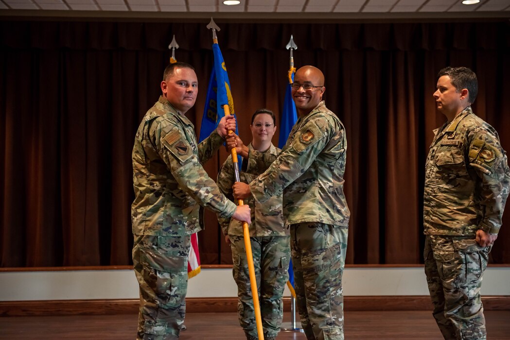 Roley hands off the unit flag to Pond.