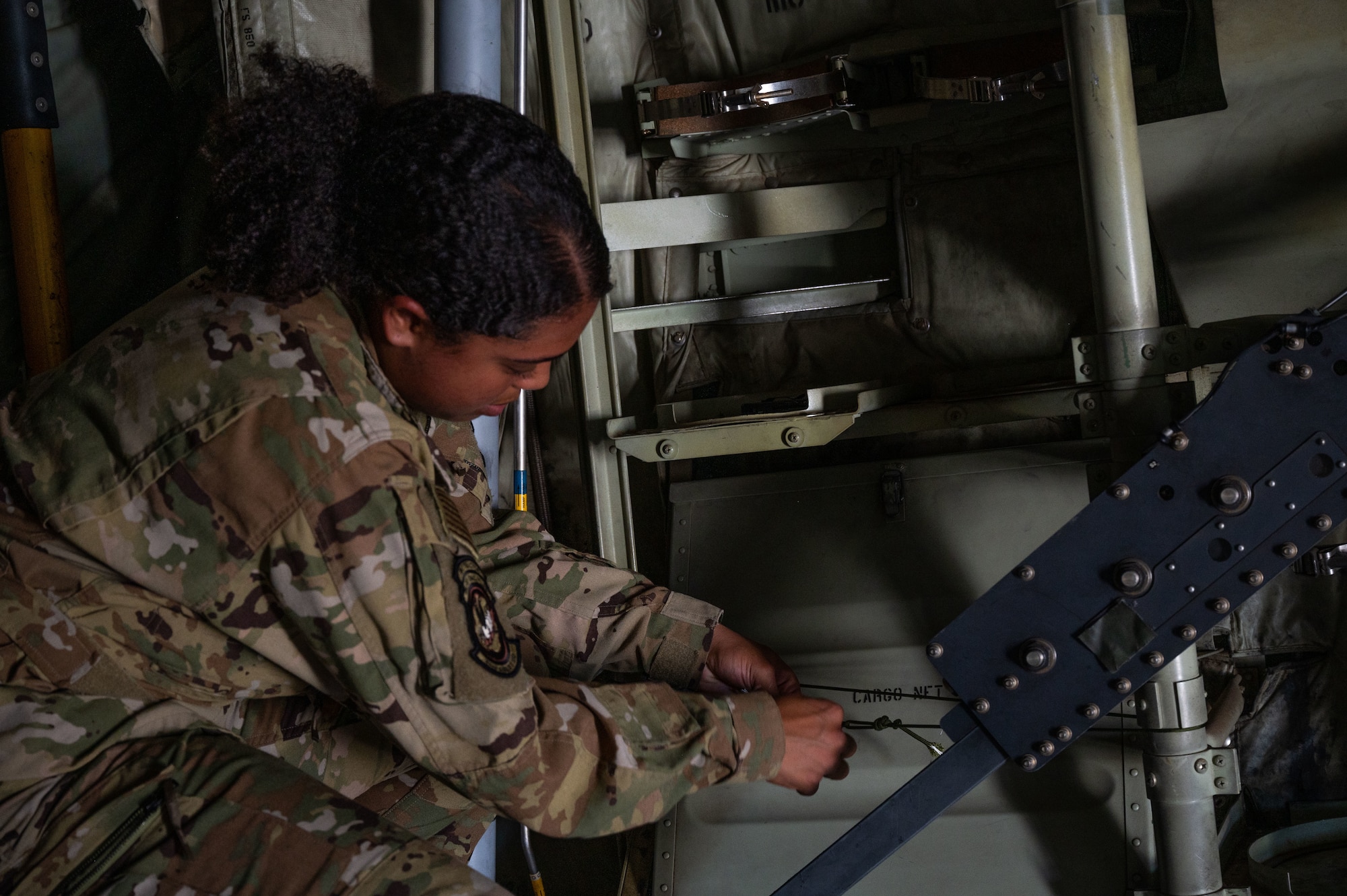 An Airman ties knots on a rope