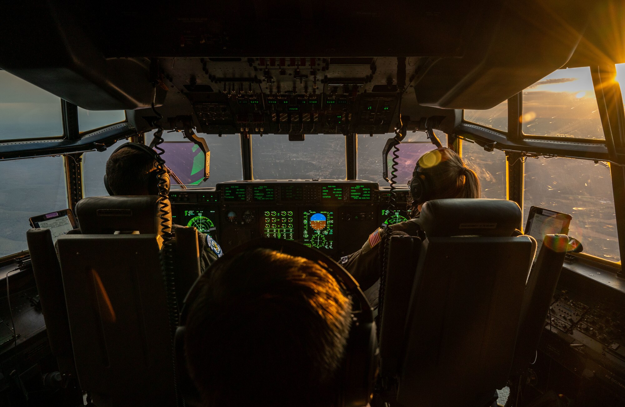 Pilots fly a C-130