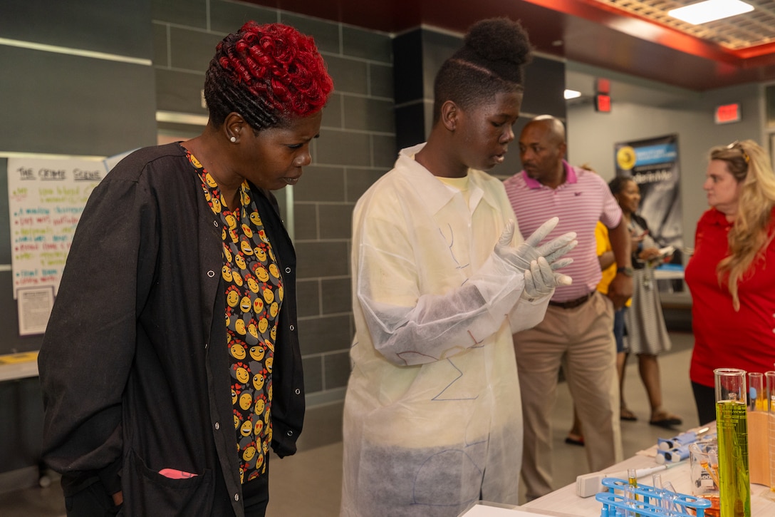 Chaez Moore, a tenth grader at River City Early College, does a science project