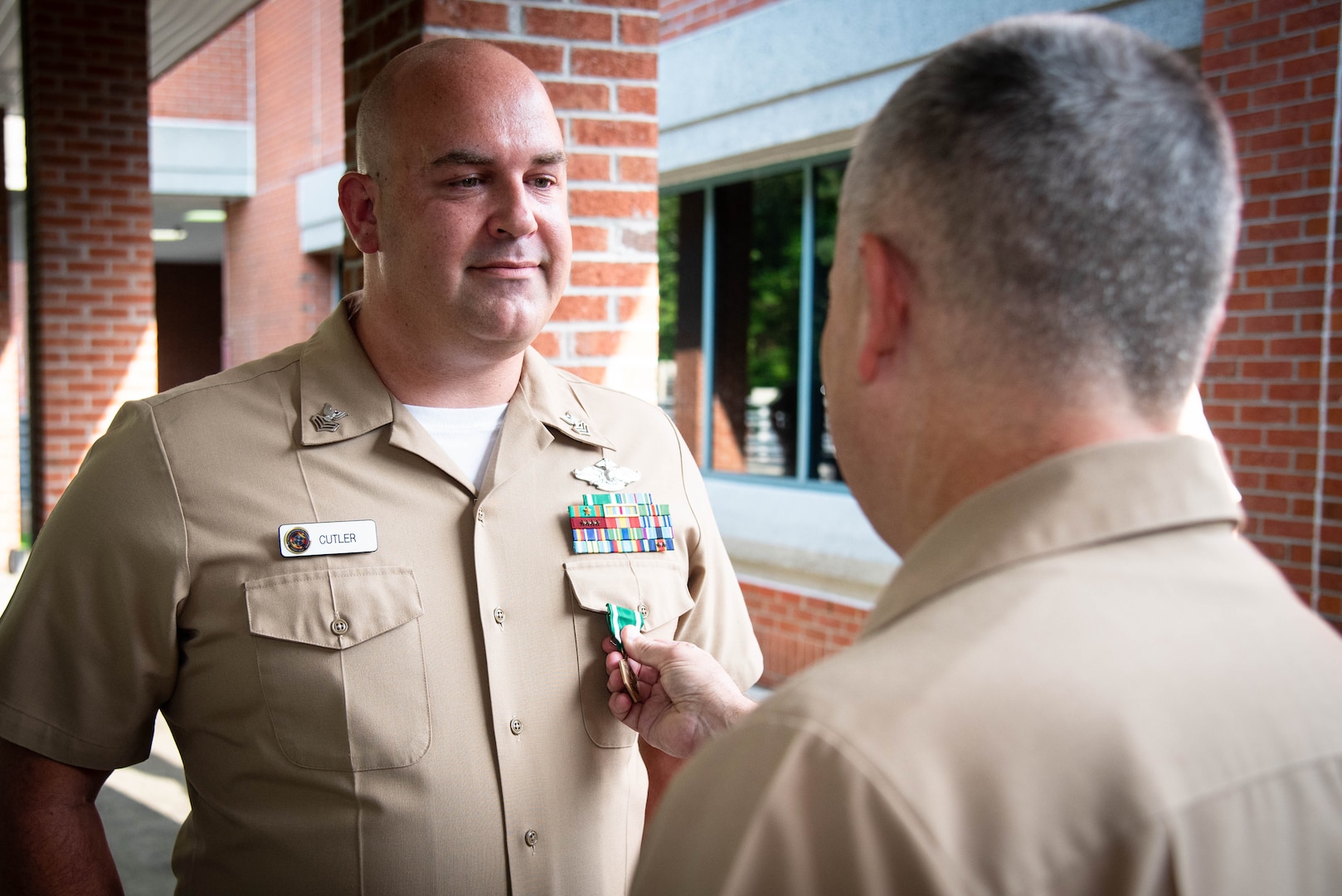 Hospital Corpsman First Class (Fleet Marine Force) Matthew Cutler, left, receives the Navy and Marine Corps Commendation Medal from Capt. Sean Barbabella, Commander of Naval Health Clinic Cherry Point during a ceremony held Friday, July 21.

Cutler received the award for his dedication to patient care and medical operations while serving aboard Naval Branch Health Clinic, Naval Base Coronado from April 2018 to March 2022.