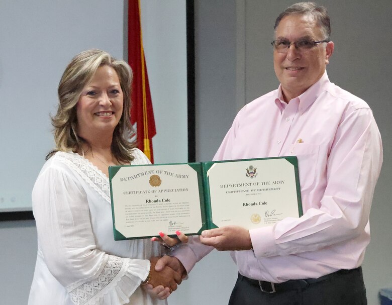 Rhonda Cole, U.S. Army Corps of Engineers, Mobile District CIO/G6 operations officer receives her retirement certificate from Ronald Fletcher, Chief of Acquisitions and Contract Management Office (ACMO) during her retirement ceremony at the Mobile District Office annex building Mobile, Alabama, July 14, 2023. Cole retires after 40 years of service in the federal government, the last seven of which were spent with the Mobile District. (U.S. Army photo by Chuck Walker)
