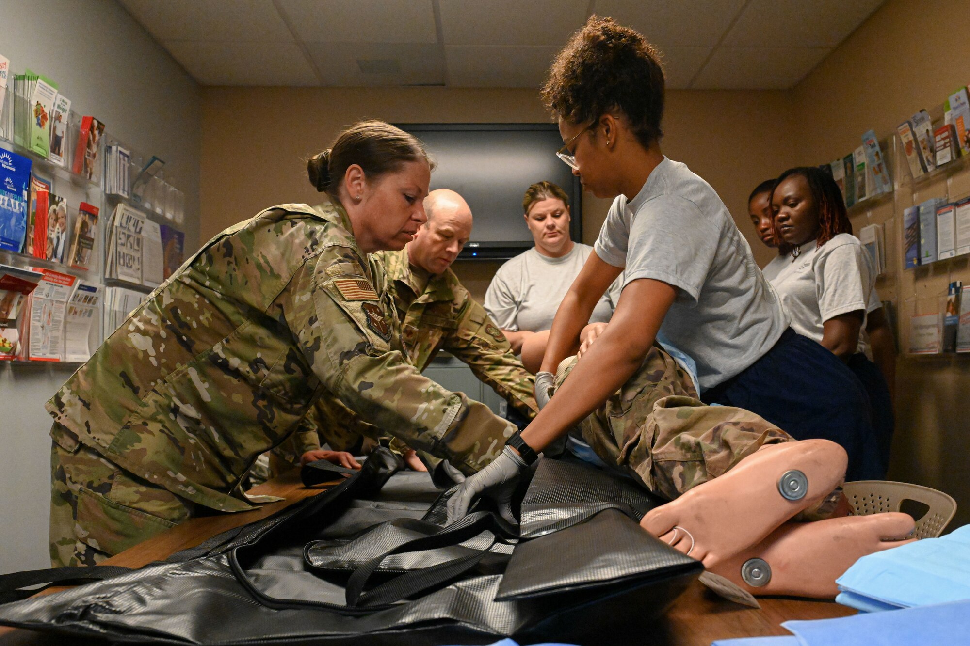 Airmen transport a simulated patient.