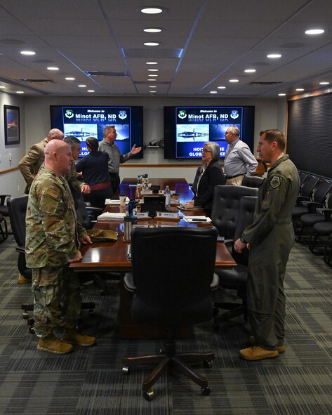 Leadership from the Defense Logistics Agency speak to Col. Daniel Hoadley, 5th Bomb Wing commander at Minot Air Force Base, North Dakota, July 18, 2023. As the nation’s combat logistics support agency, DLA manages the end-to-end global defense supply chain for the Department of Defense. (Air Force photo by Senior Airman Caleb S. Kimmell)