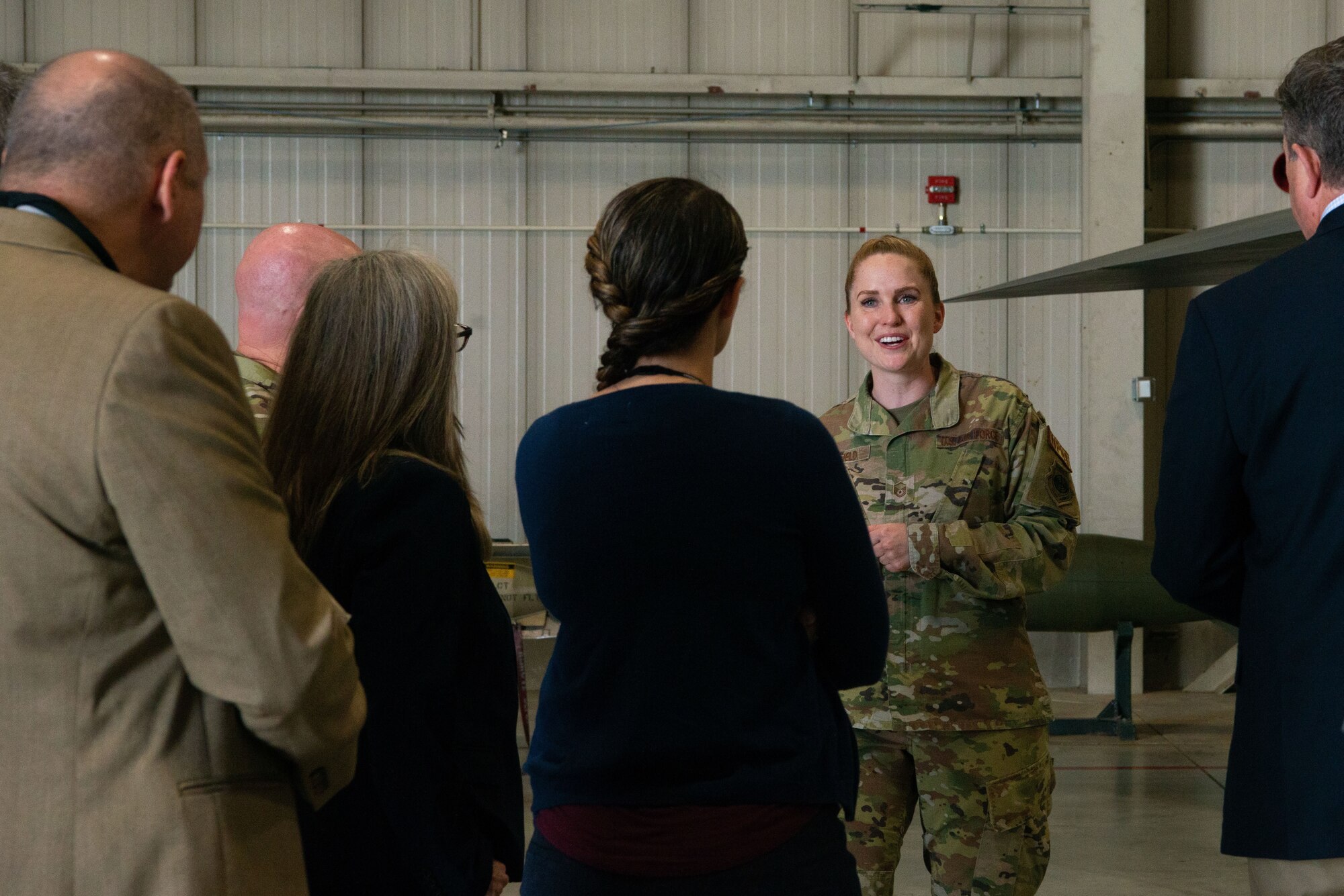 U.S Air Force Master Sgt. Shelley Schofield, 5th Maintenance Group weapon standardization superintendent, gives a tour of a B-52H Stratofortress to the Defense Logistics Agency at Minot Air Force Base, North Dakota, July 18, 2023. As the nation’s combat logistics support agency, DLA manages the end-to-end global defense supply chain for the Department of Defense. (Air Force photo by Airman 1st Class Alyssa Bankston)