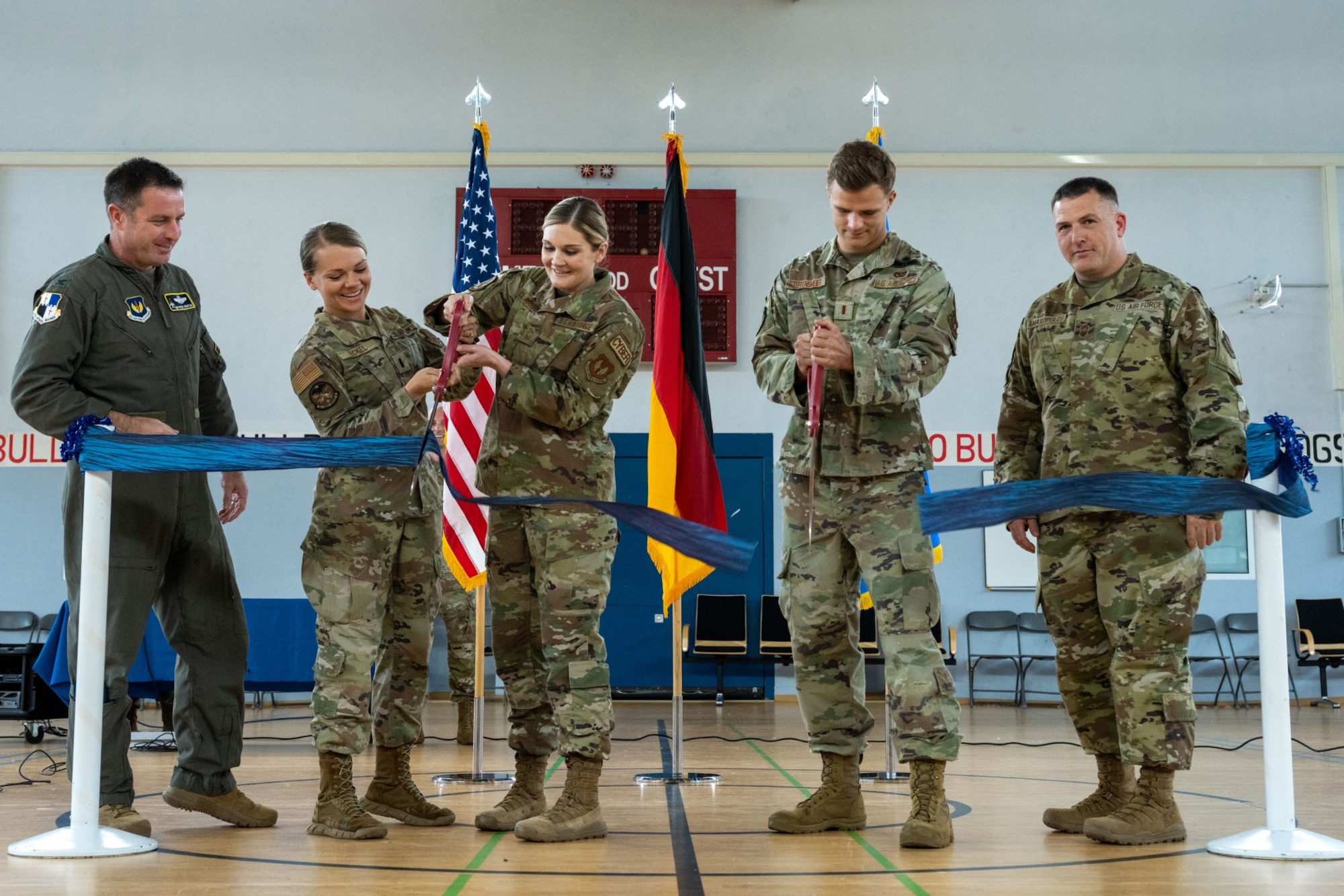 Wing leadership cut the ceremonial ribbon during the Community Commons opening ceremony at Spangdahlem Air Base, Germany, July 21, 2023.