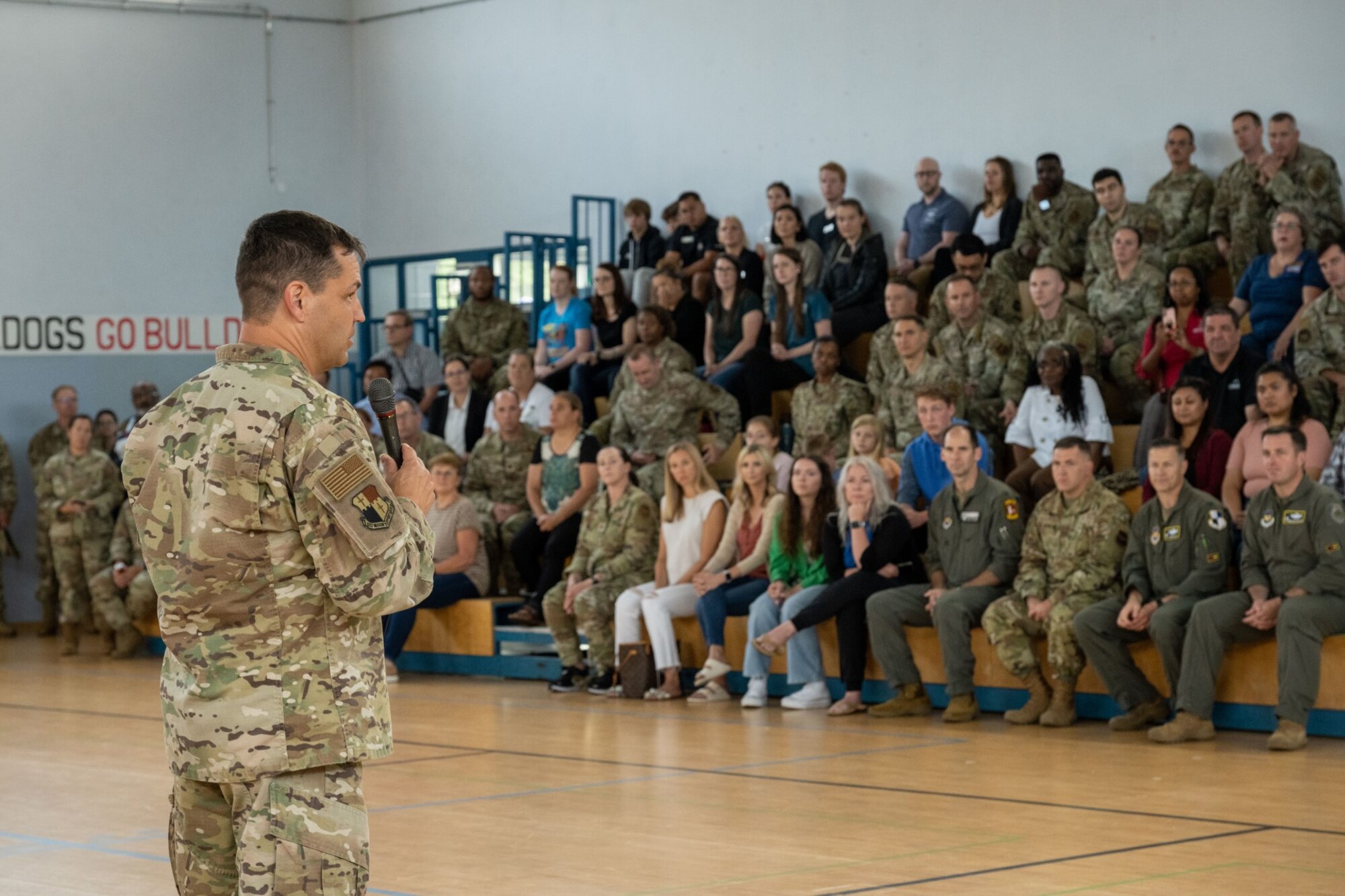 U.S. Air Force Col. Steven Lamb, 52nd Mission Support Group commander, delivers opening remarks during the Community Commons ribbon-cutting ceremony at Spangdahlem Air Base, Germany, July 21, 2023